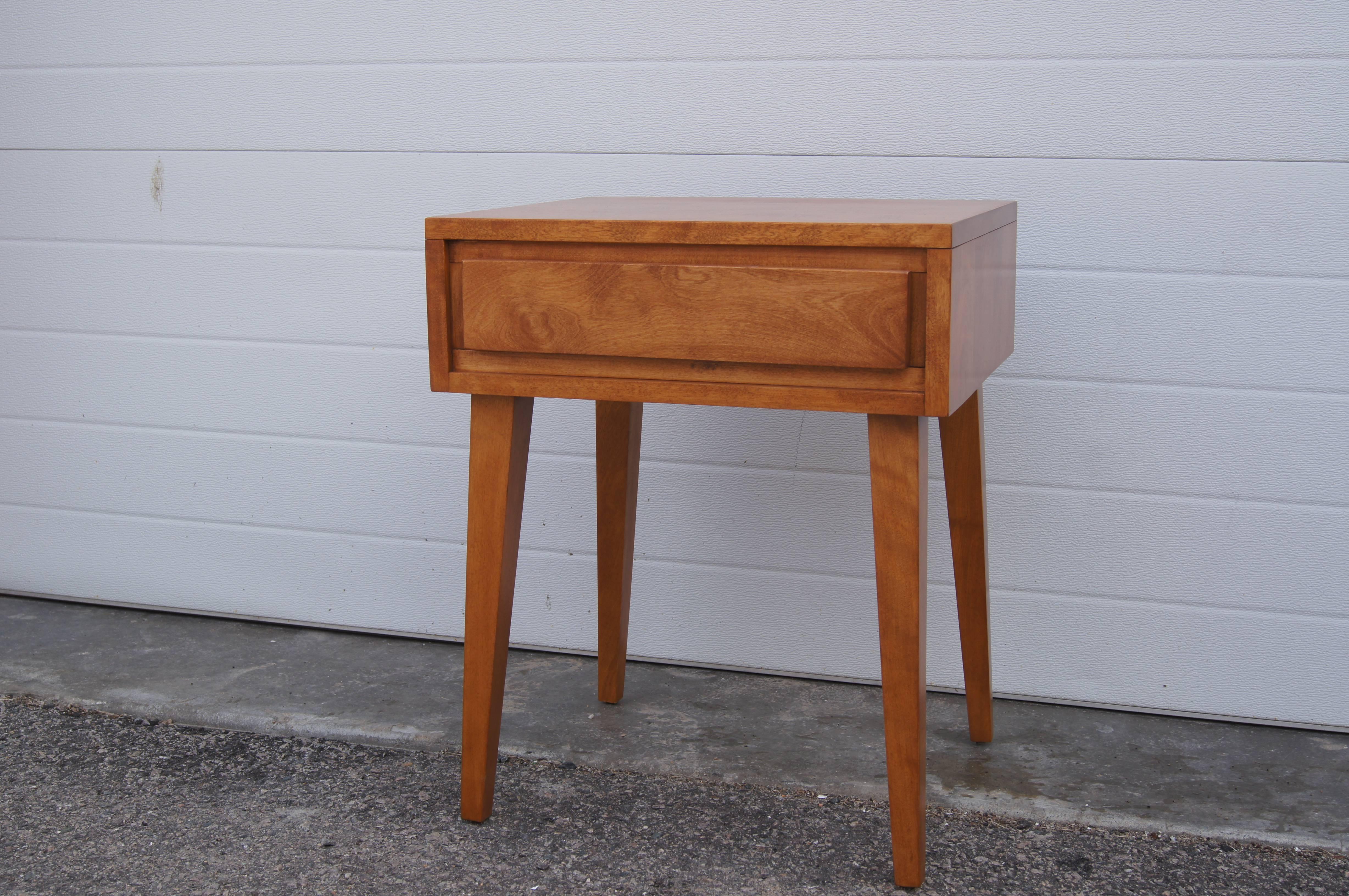 Designed by Leslie Diamond as part of Conant Ball's Modernmates collection, this handsome nightstand, number 5401, comprises a single-drawer case set on splayed feet and is crafted from solid birch.