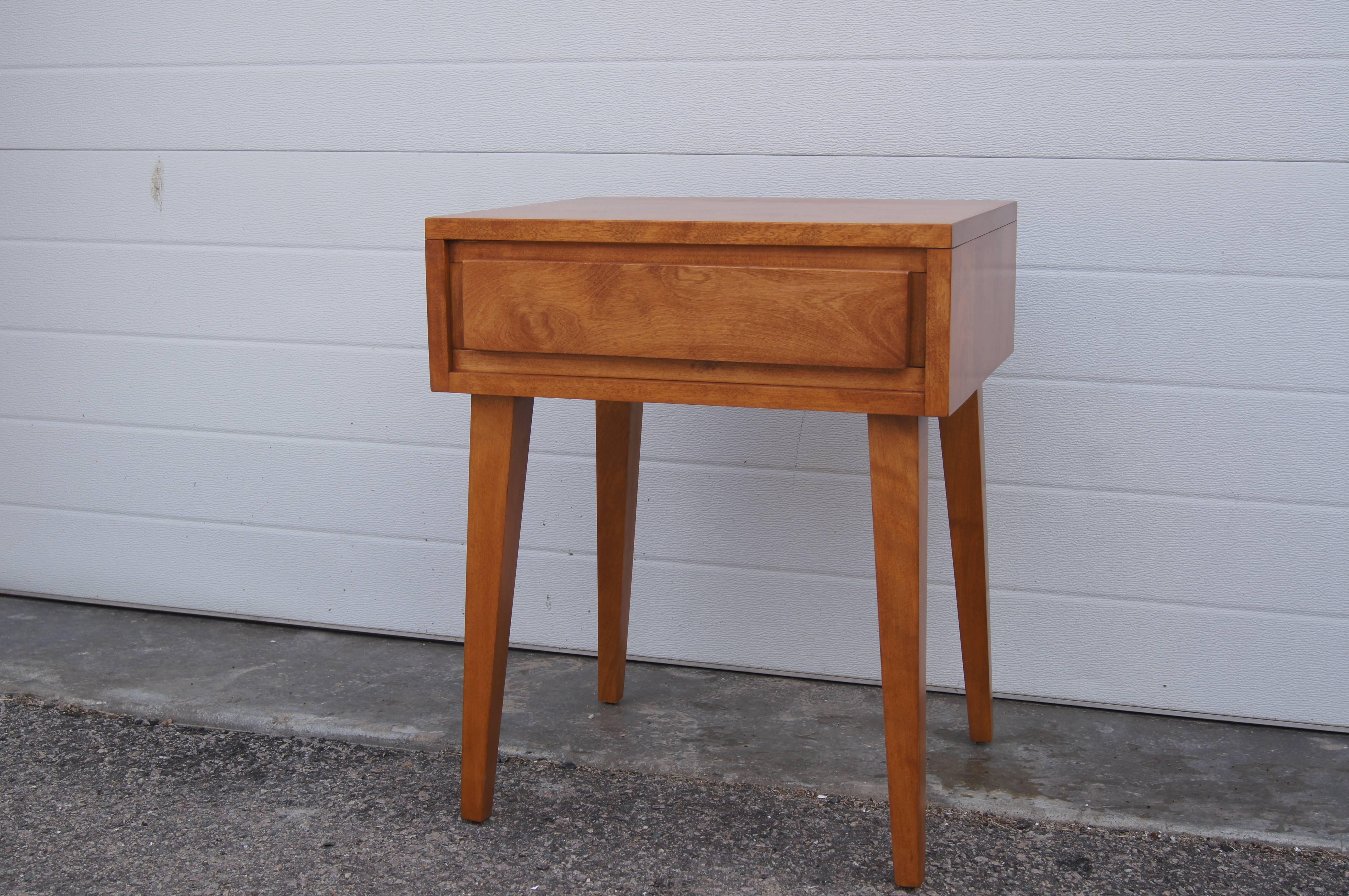 Designed by Leslie Diamond as part of Conant Ball's Modernmates collection, this handsome nightstand, number 5401, comprises a single-drawer case set on splayed feet and is crafted from solid birch.