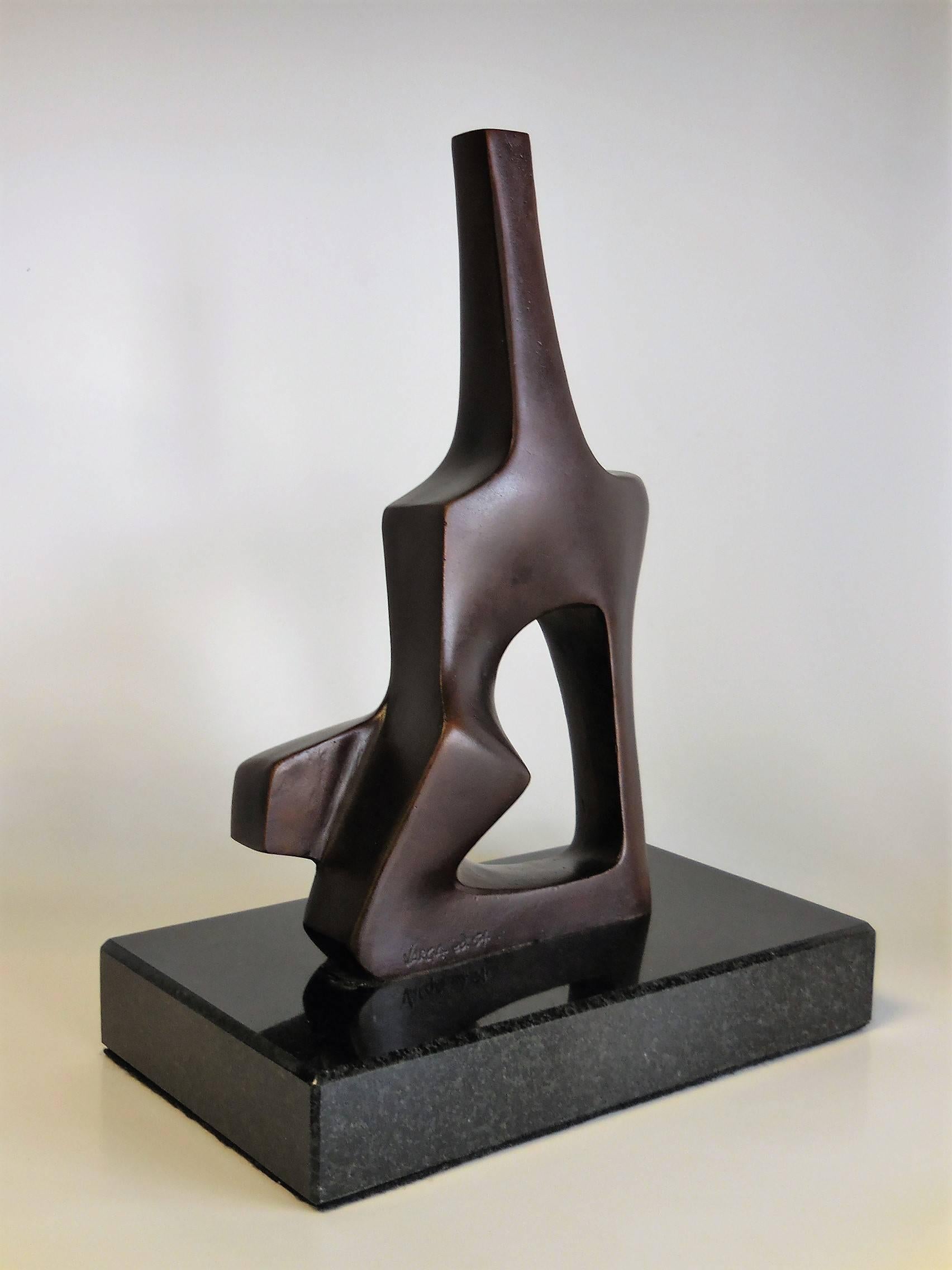 A bronze sculpture on a black granite base. Great modernist shapes with a Futurist flair.