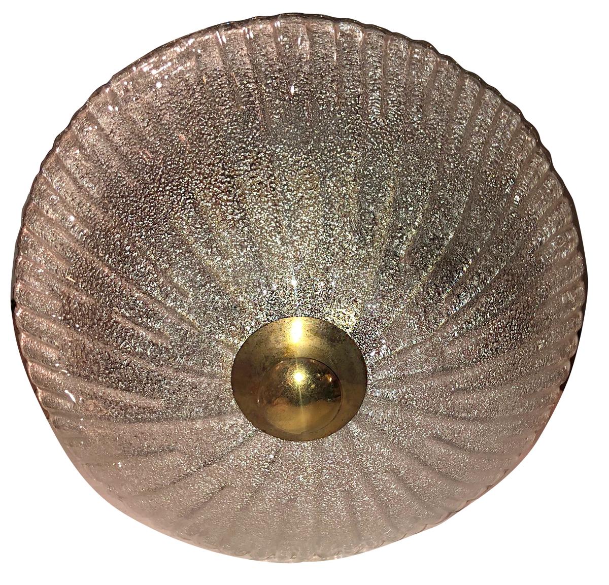 A circa 1960s Italian molded glass light fixture with interior lights.

Measurements:
Diameter 16