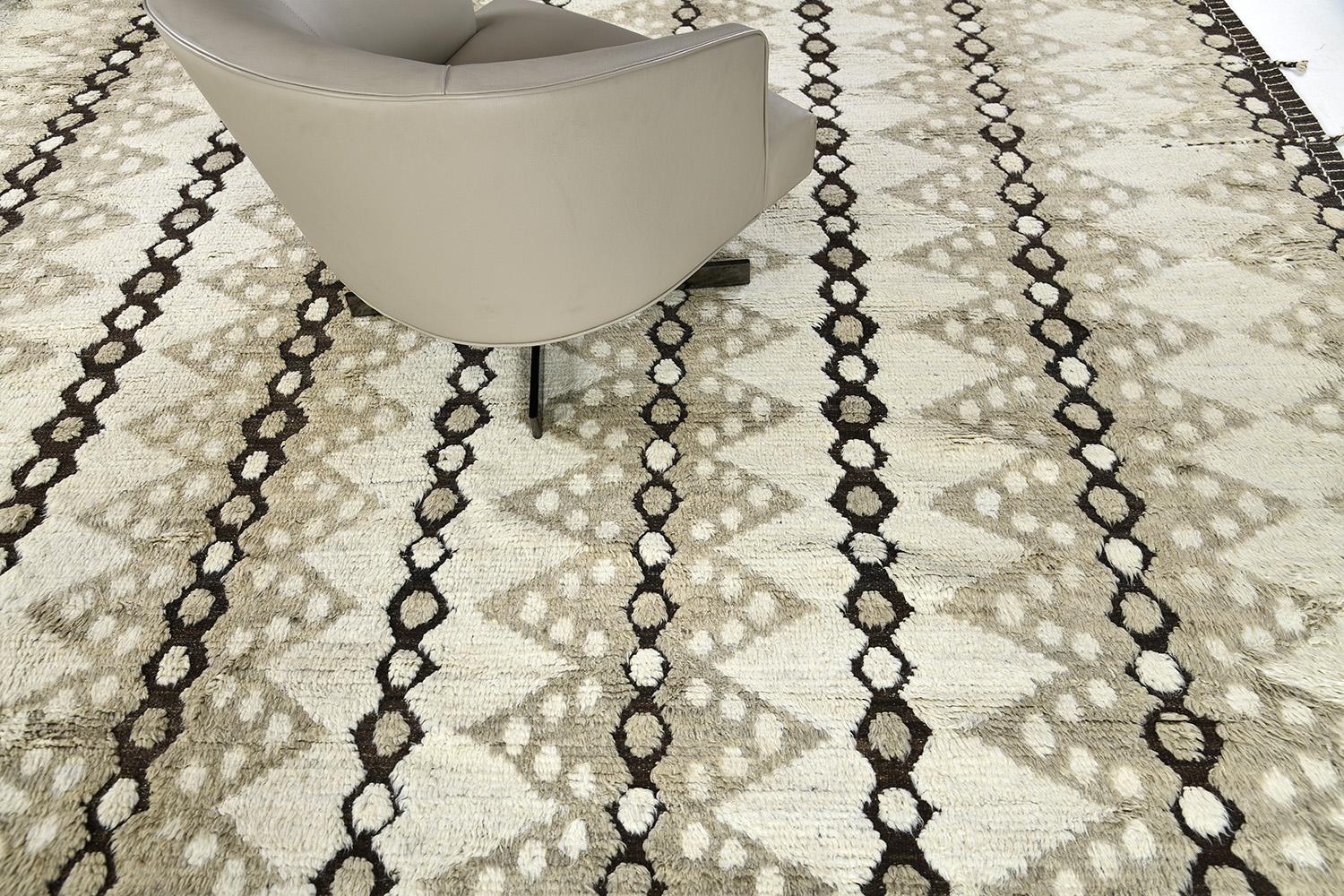 The 'Modlina' rug is a handwoven wool piece inspired by vintage Scandinavian design elements and recreated for the modern design world. The rug's shag balance and harmony, handwoven with a neutral flat weave and unique piles of yellow and natural