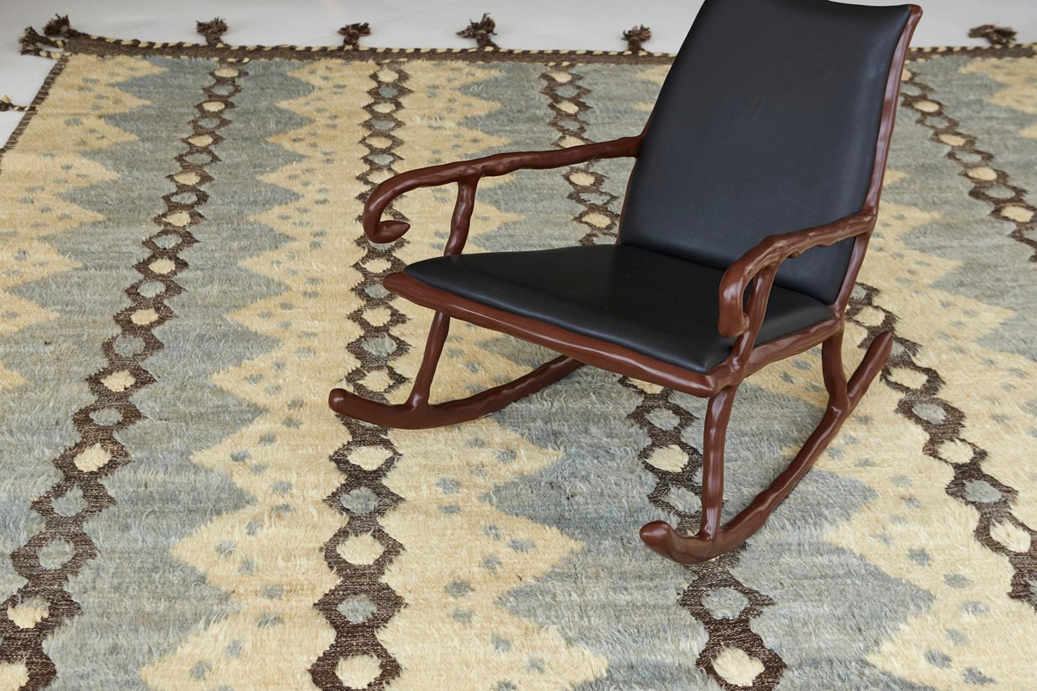 The 'Modlina' rug is a handwoven wool piece inspired by vintage Scandinavian design elements and recreated for the modern design world. The rug's shag balance and harmony, handwoven with a neutral flat weave and unique piles of yellow and natural