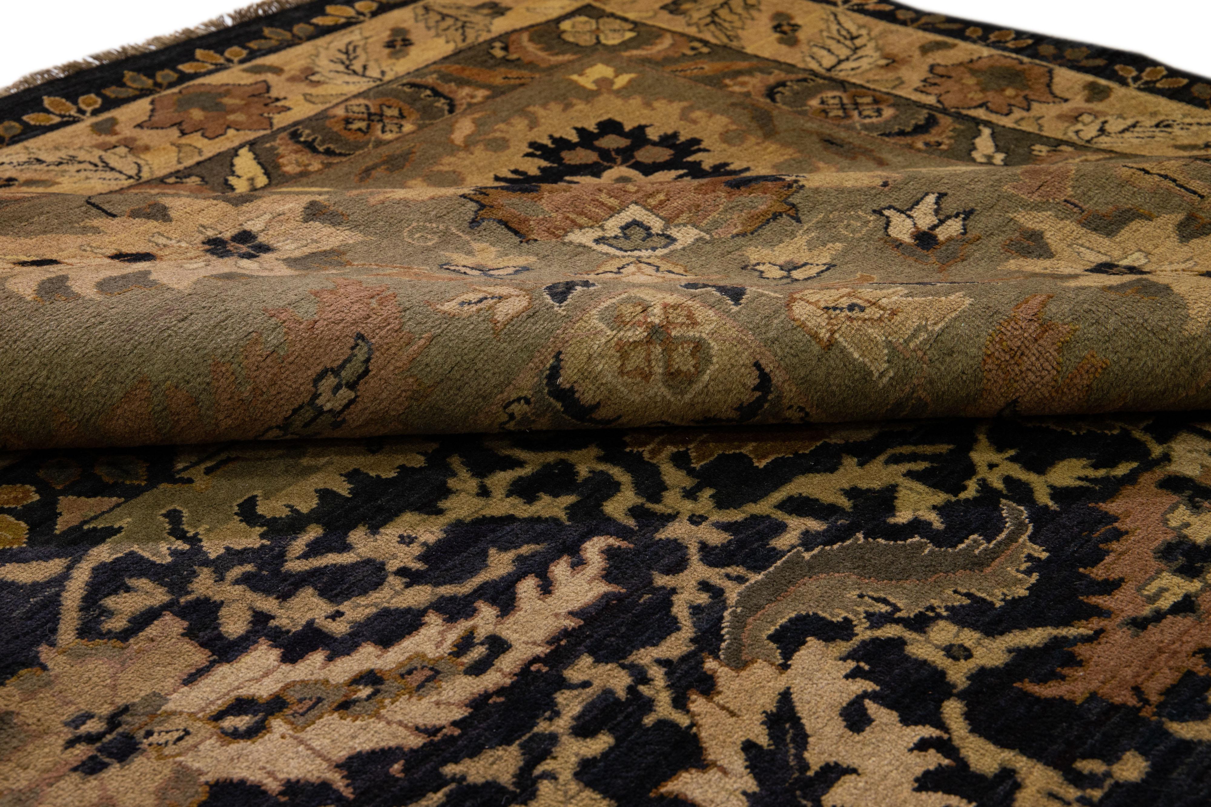 Beautiful Modern Indian Sultanabad Style hand-knotted wool rug with a black field. This piece has a green olive color-designed frame with rust and beige accents in a gorgeous all-over floral pattern design.

This rug measures: 20' x 23'7