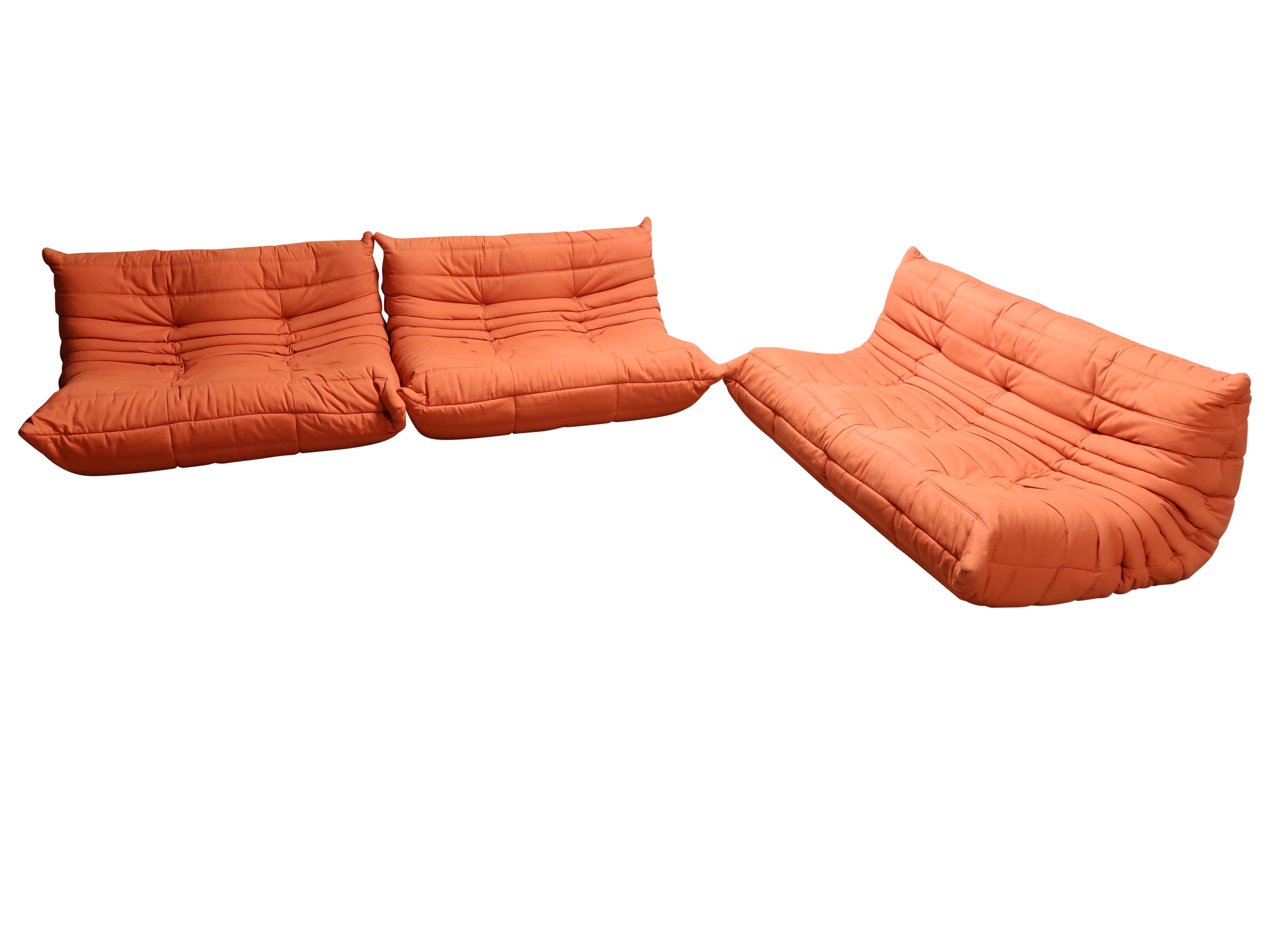 The iconic Togo sofa, originally designed by Michael Ducaroy for Ligne Roset in 1973, has become a design Classic.

This set consists of one three-seat and two-seat modules.

Very good condition.

Made completely from foam, with three