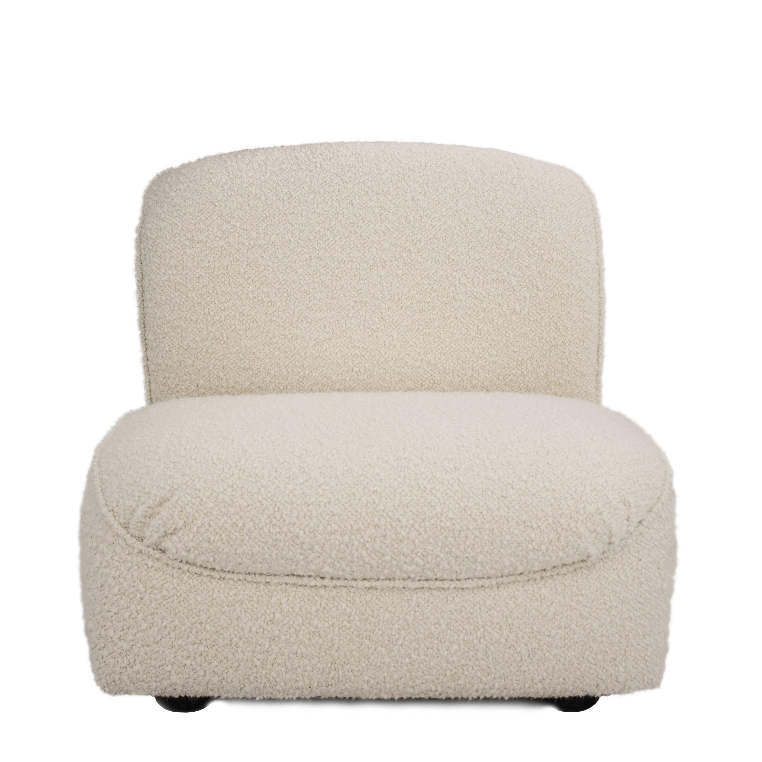 Modular armchair designed by Afra and Tobia Scarpa for Cassina in 1968 in Italy. it is made on a solid wood structure covered in foam and upholstered by hand in a beige bouclé. It is a comfortable and versatile modular design that can be used