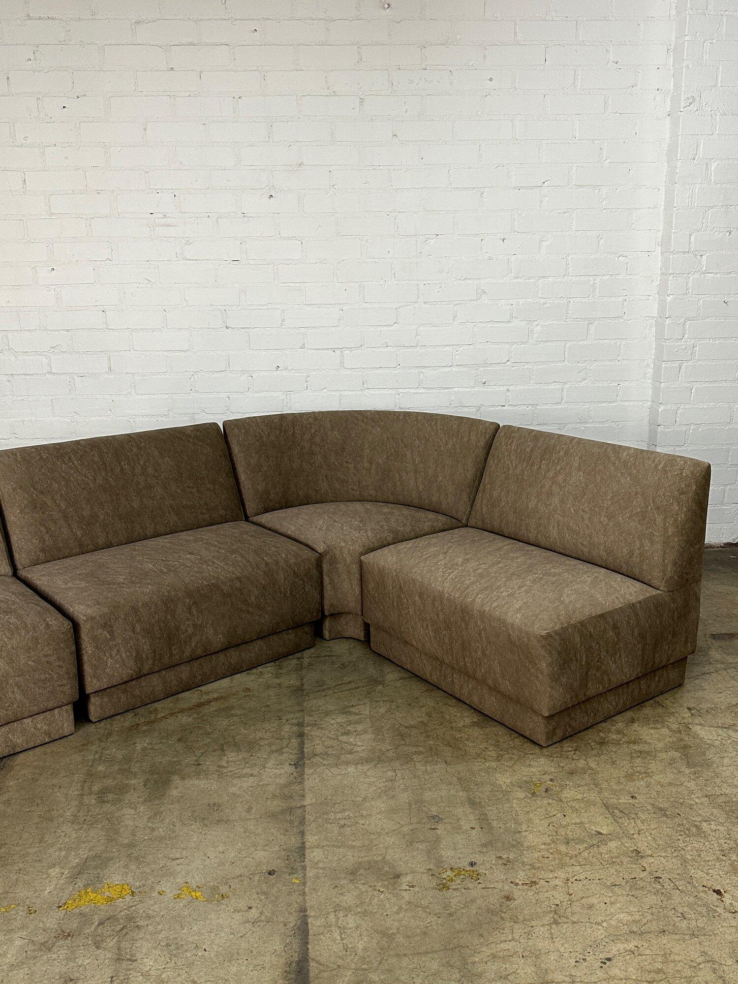 W118 D71 D30 H30 SW146 SD20 SH16

STRAIGHT PIECE W34 D30

Curve W47 D33

Fully upholstered modular seating with new foam. Each unit is freshly upholstered in a warm grey patterned smooth velvet. Price is four the set as pictured. 