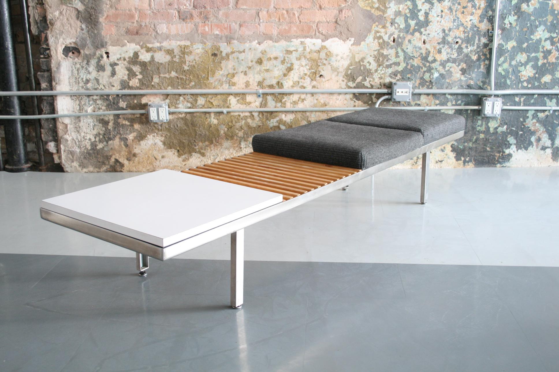 A rare piece in an uncommon arrangement of components. This piece features 2 cushions, 1 slat and 1 white laminate table. All are modular and can be moved around along the steel frame. All in good condition with some small areas of finish loss to