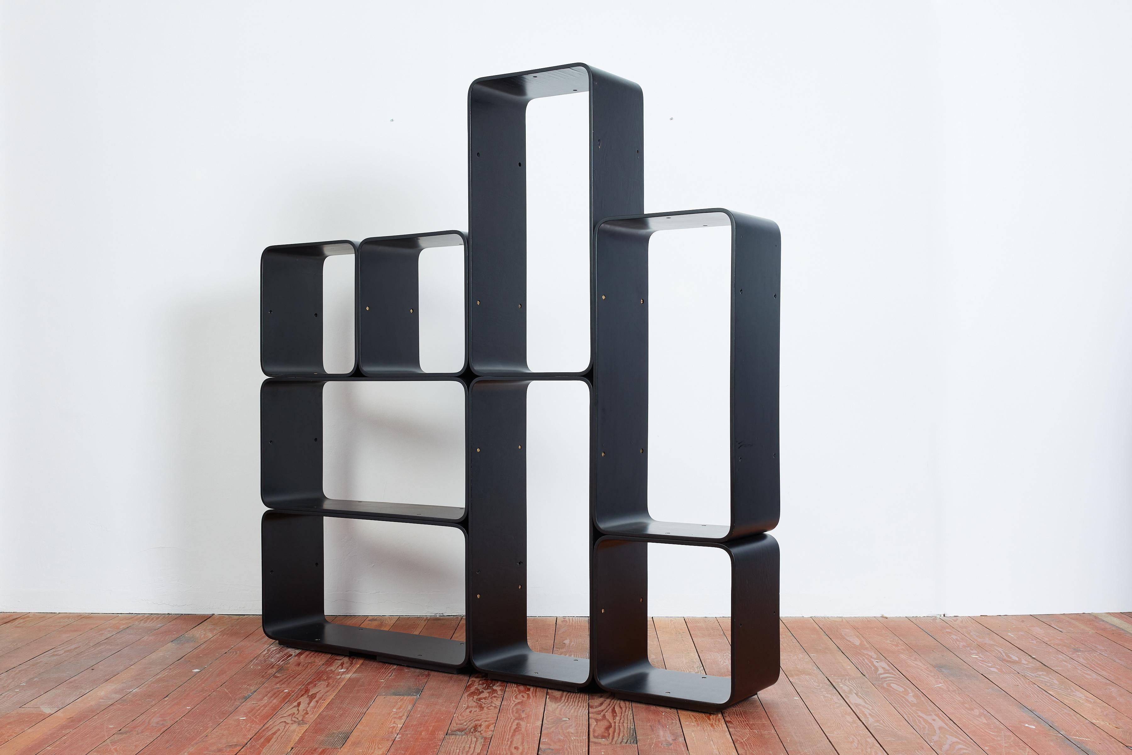 Italian modular bookcase by Carlo de Carli for Fiarm - Italy, 1970s
Comprised of 5 rectangular shapes and 3 square shaped modules - Bookcase is connected with brass hardware and one solid piece
Original black lacquer - professionally restored

