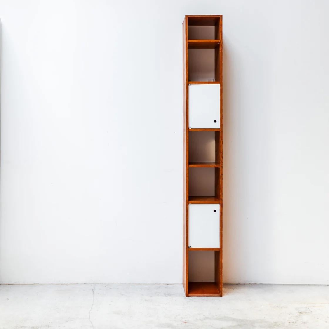 A rare modular cabinet designed by Pierre Guariche for the French resort project La Plagne. This versatile piece can be used horizontally as a low console, display bench, or TV stand — or vertically as a slim shelving unit. Its minimalist form,