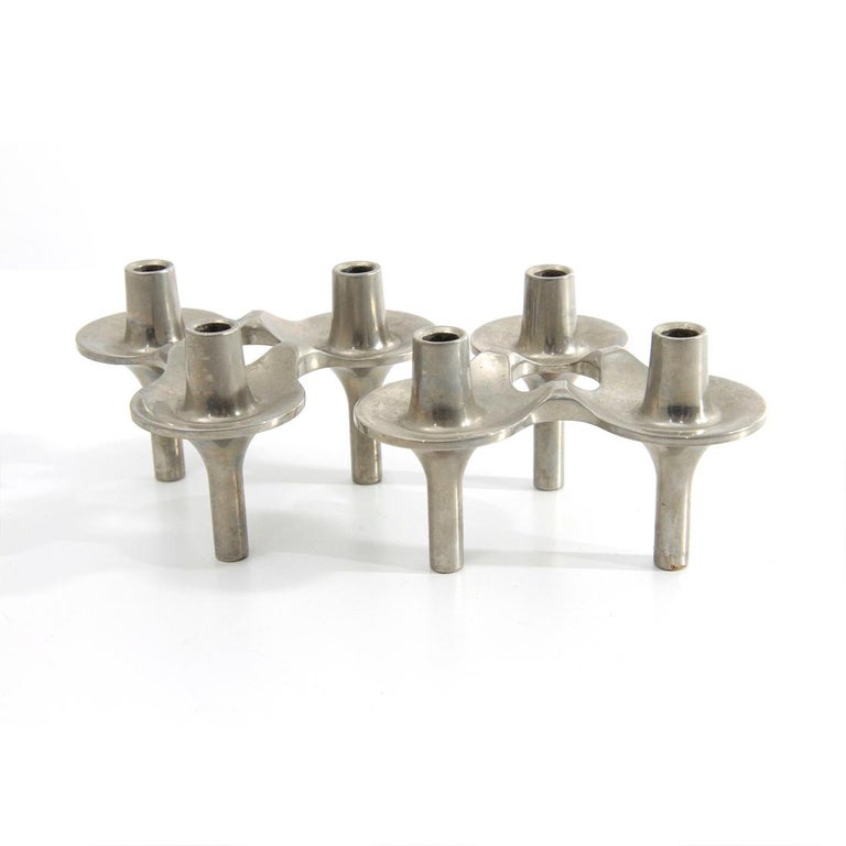 Pair of candle holders produced in the 1960s by BMF designed by Ceasar Stoffi and Fritz Nagel.
Chromed metal frame.
Each candleholder can hold three candles.
The candle holders can be assembled as desired.
Good general conditions.

Dimensions: