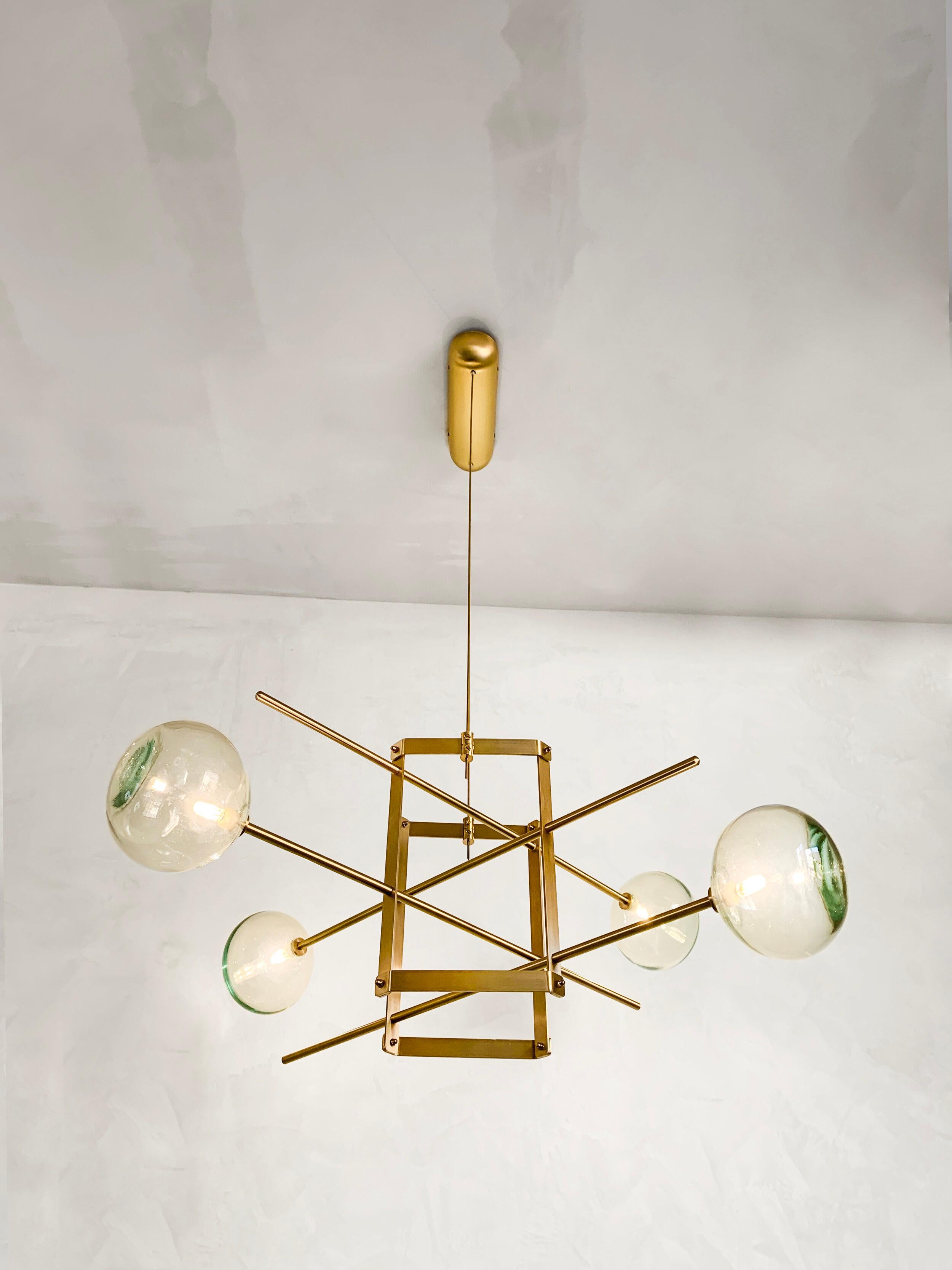 Modular chandelier 4 lamps by Contain.
Dimensions: D 85 x W 85 x H 29.5 cm (custom length).
Materials: Brass structure, blown glass from local production.
Available in different finishes and dimensions.

All our lamps can be wired according to