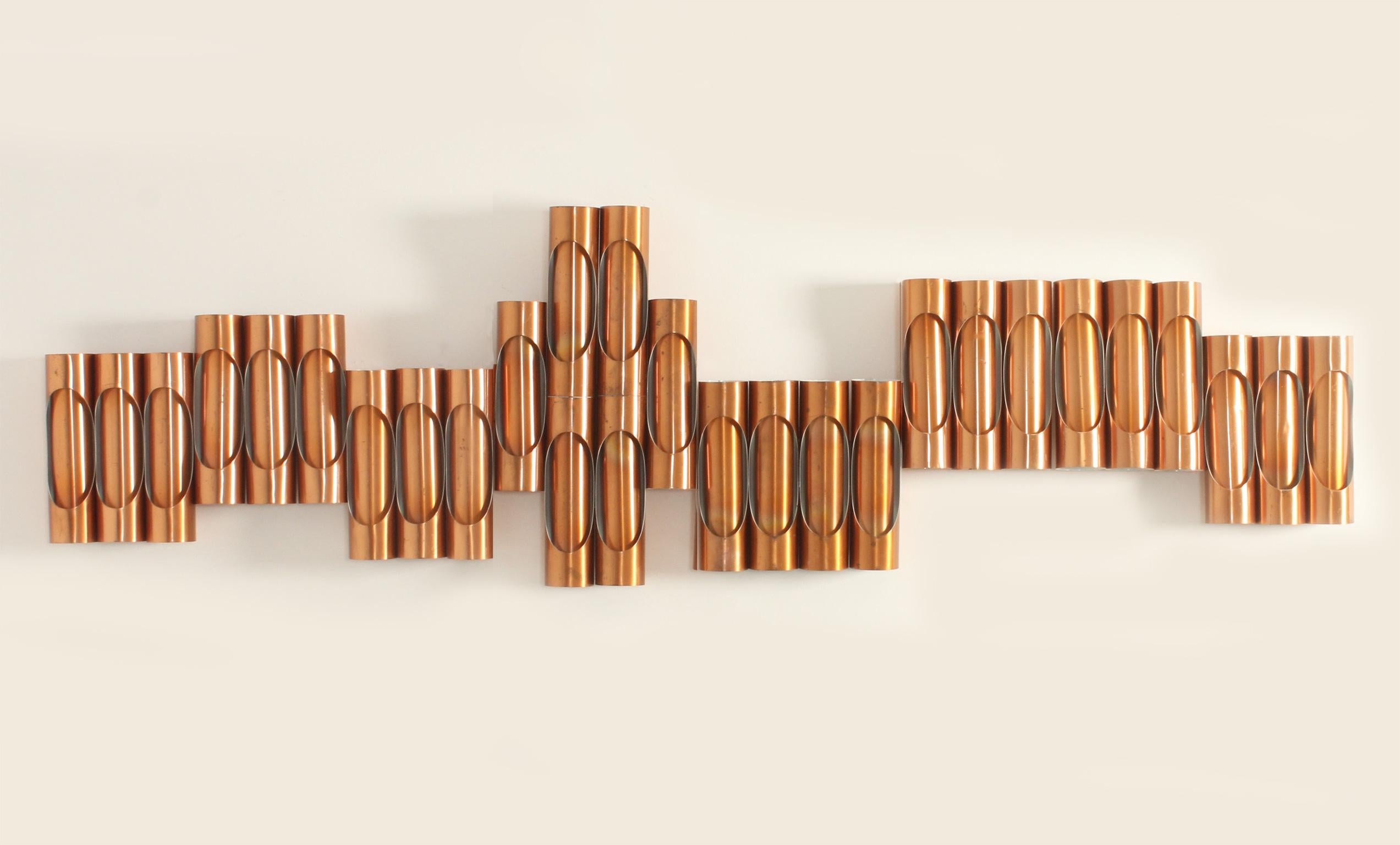 Modular composition of copper wall lights from 1960's, Spain. Composed of 28 units of wall lights in various sets, a double height wall light with six units (33 W. x 9 D. x 61 H.), a wall light with four units (33 W. x 9 D. x 30 H. ) and six