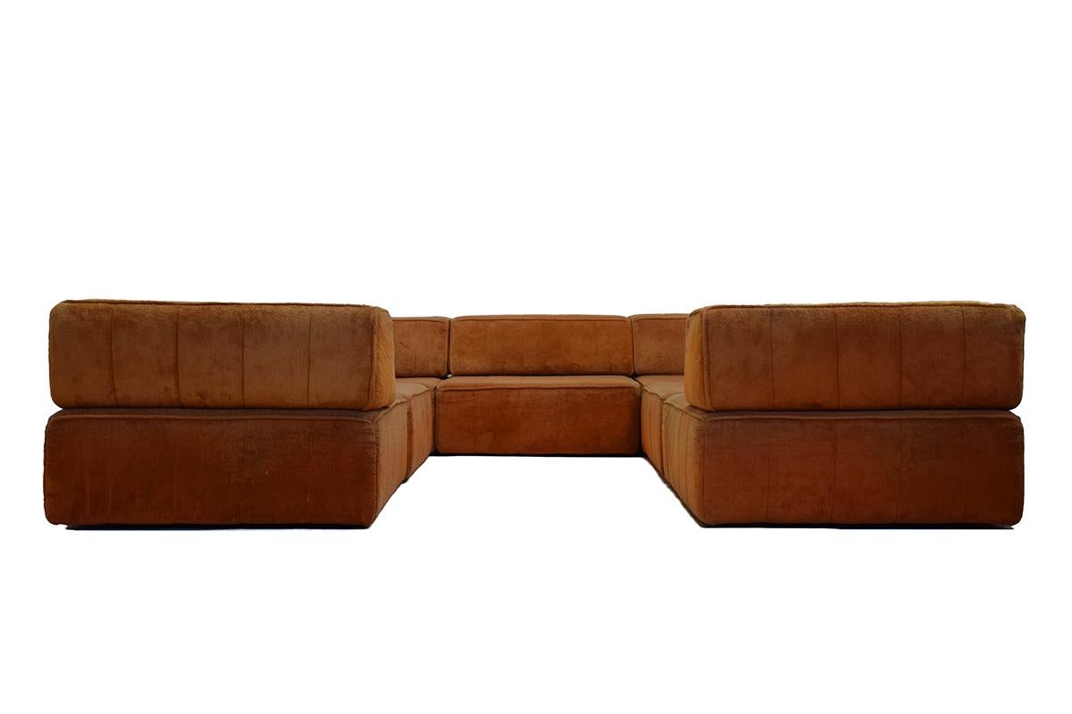 Very large set seat-scape modules named 'Trio Sofa' designed by Team Form AG for COR Germany in 1972. With a light orange Teddy upholstery. The set consists of 7 modules with 3 straight and four angular back rests. Multiple configurations are