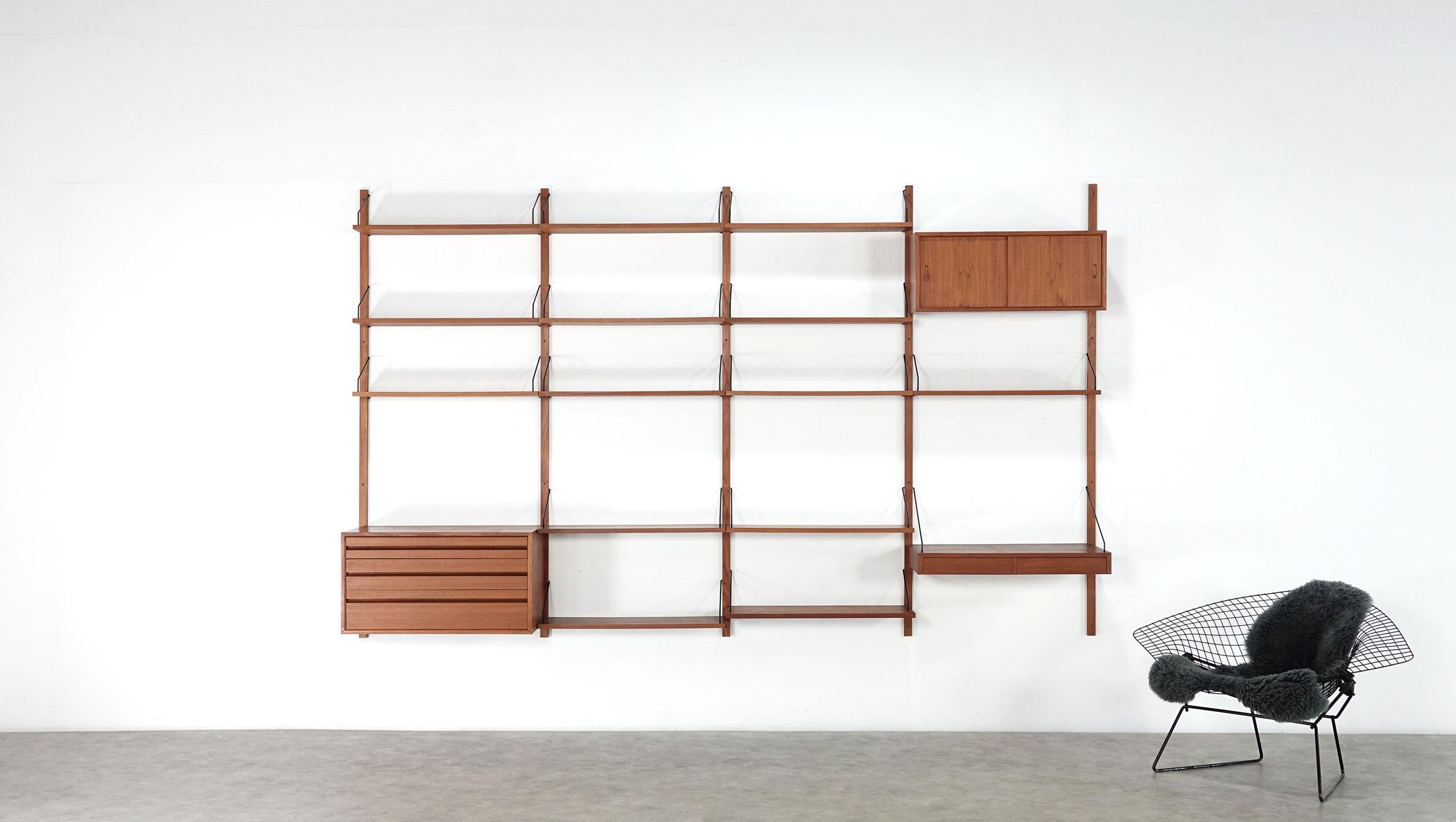 Cado Royal system shelf designed in 1948 by Poul Cadovius for Cado, Denmark. Teak wood with black brackets. A drawer unit with four drawers, a desk and a box with sliding doors.


Poul Cadovius (1911-2011) was a Danish furniture designer and