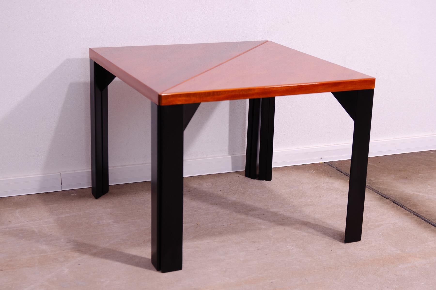 This modular table was made in the 70s in Central Europe. By dividing into two tables, you get two pieces that you can place differently in the space. It is made of wood and is lacquered to a high gloss. In excellent condition, fully professionally
