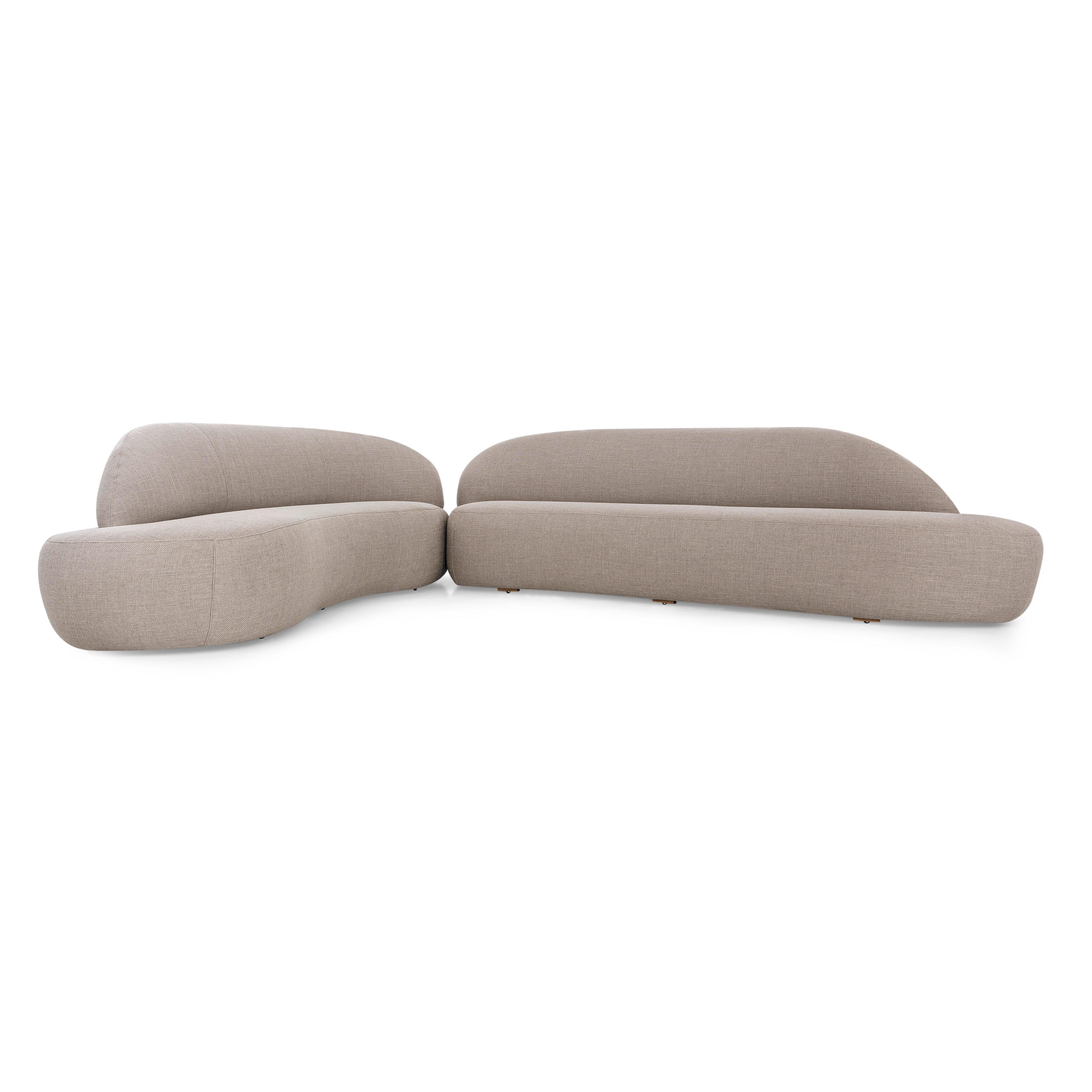 A Ruy sofa designed by Sérgio Batista for Uultis with greige fabric. The Ruy Sofa is a luxurious and eco-conscious addition to any modern living space. This modular sofa, upholstered in a premium greige fabric, captures the essence of contemporary