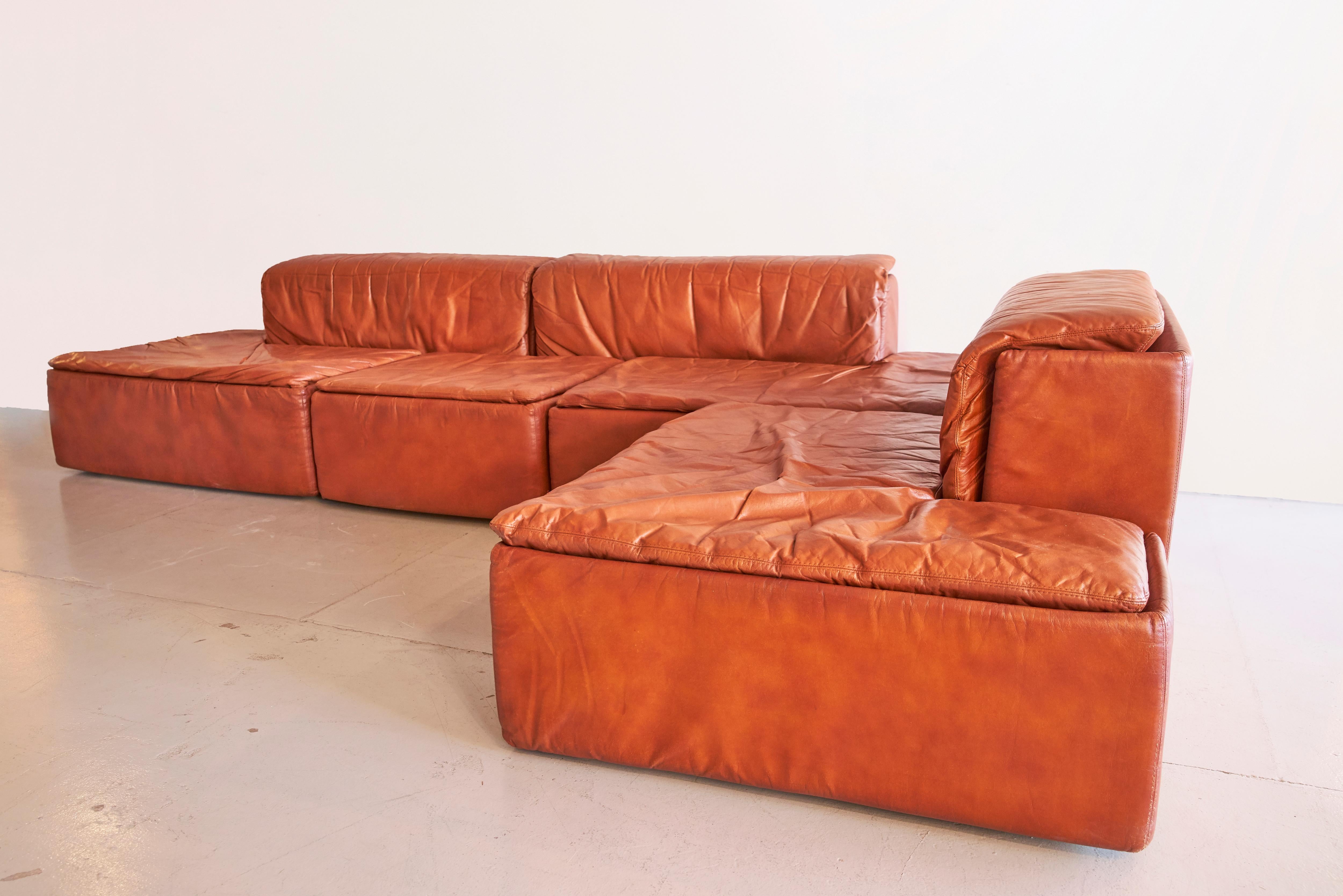 Modular leather sectional by Claudio Salocchi, circa 1969.
Fantastic patina, professionally restored.

Each section is approximately 105 x 70 x 70 H cm 282.
        