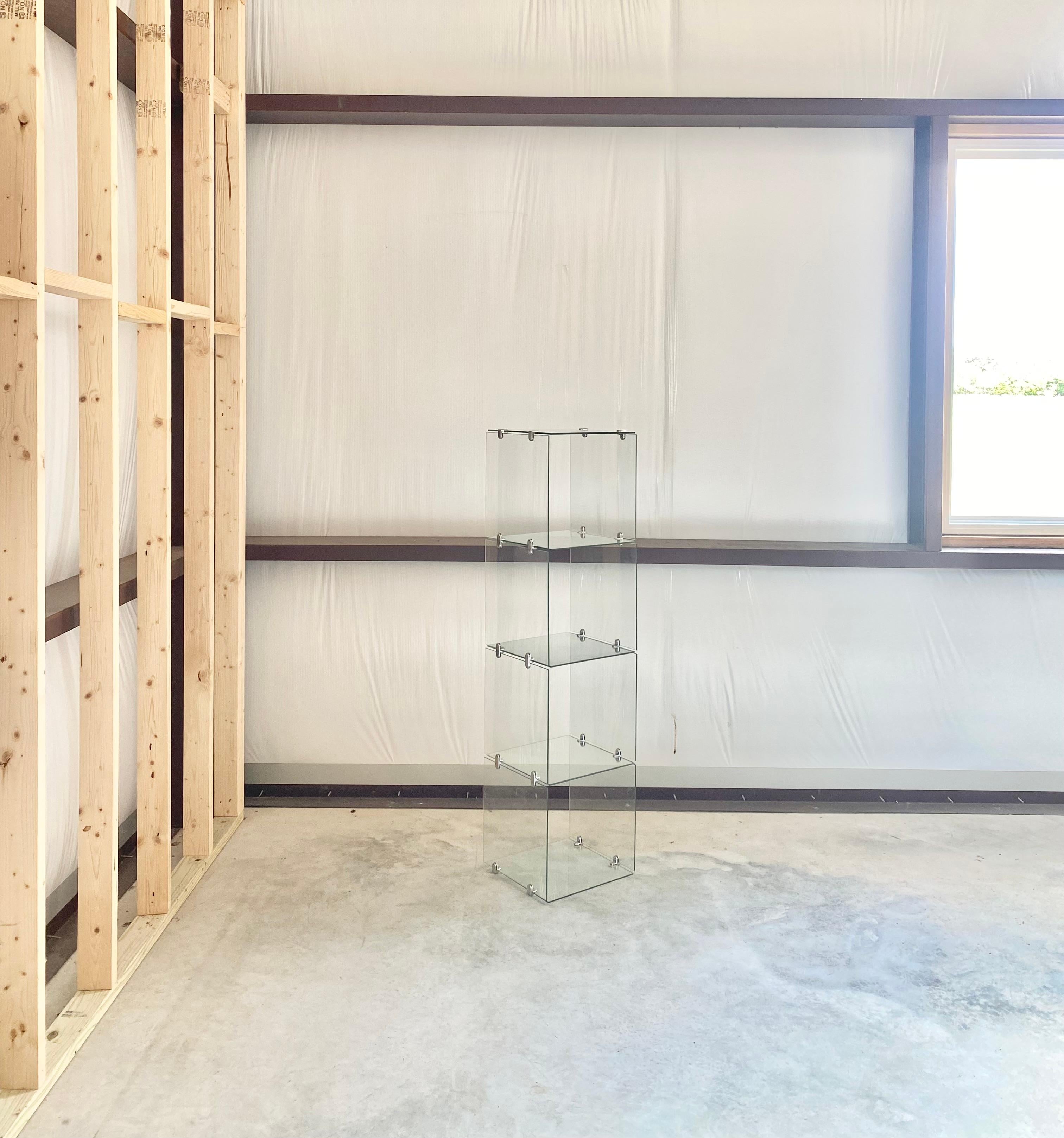 Whether for rolled fluffy white towels and a beautiful array of custom fragrances and toiletries, or stacks of books, or fresh, healthy plants, this modular glass vitrine is the least obtrusive and most adaptable display piece. It works in