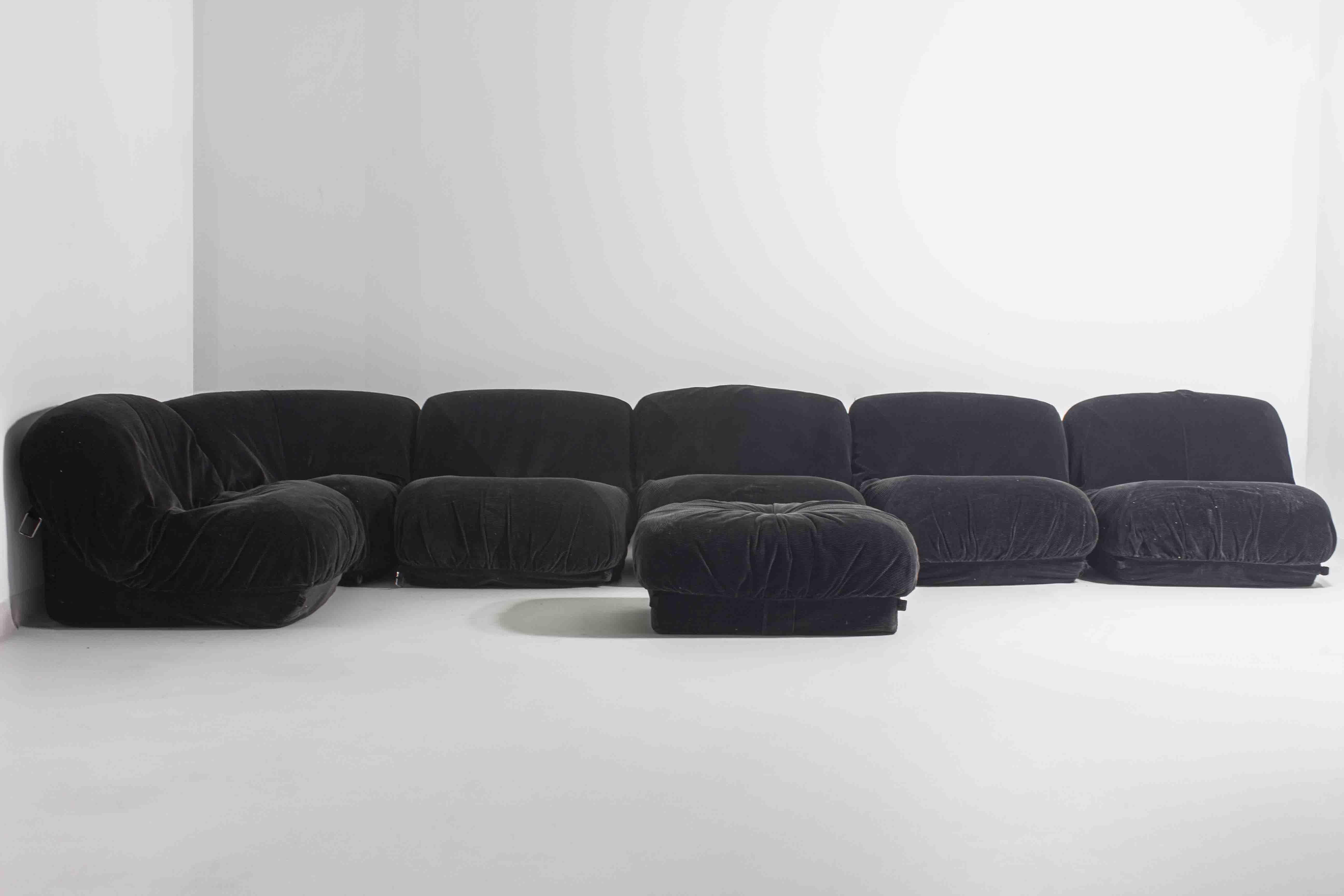 This is a seven-piece modular “Patate” sofa, made by Airborne in France in the 1970s. Each element is upholstered in black corduroy velvet and can be used on its own or combined in different layouts. The shapes are soft and low to the ground, with