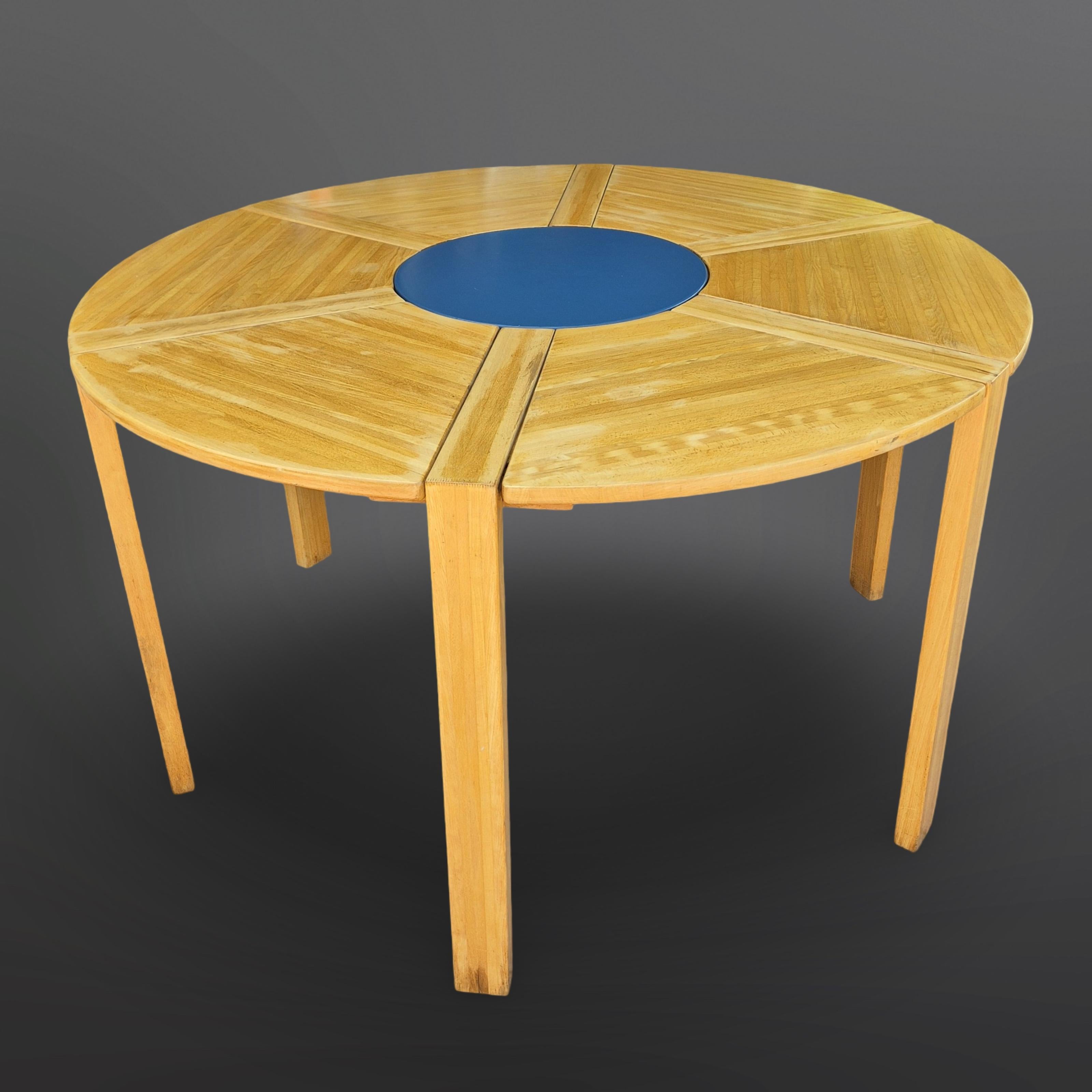 Modular puzzle dining table. Designed by Richard Nissen for Nissen furniture Denmark. The table was produced in 1978.
The table has 6 legs. The legs are designed in an L shape. They fit into 6 slots in the table top and are secured with bolts