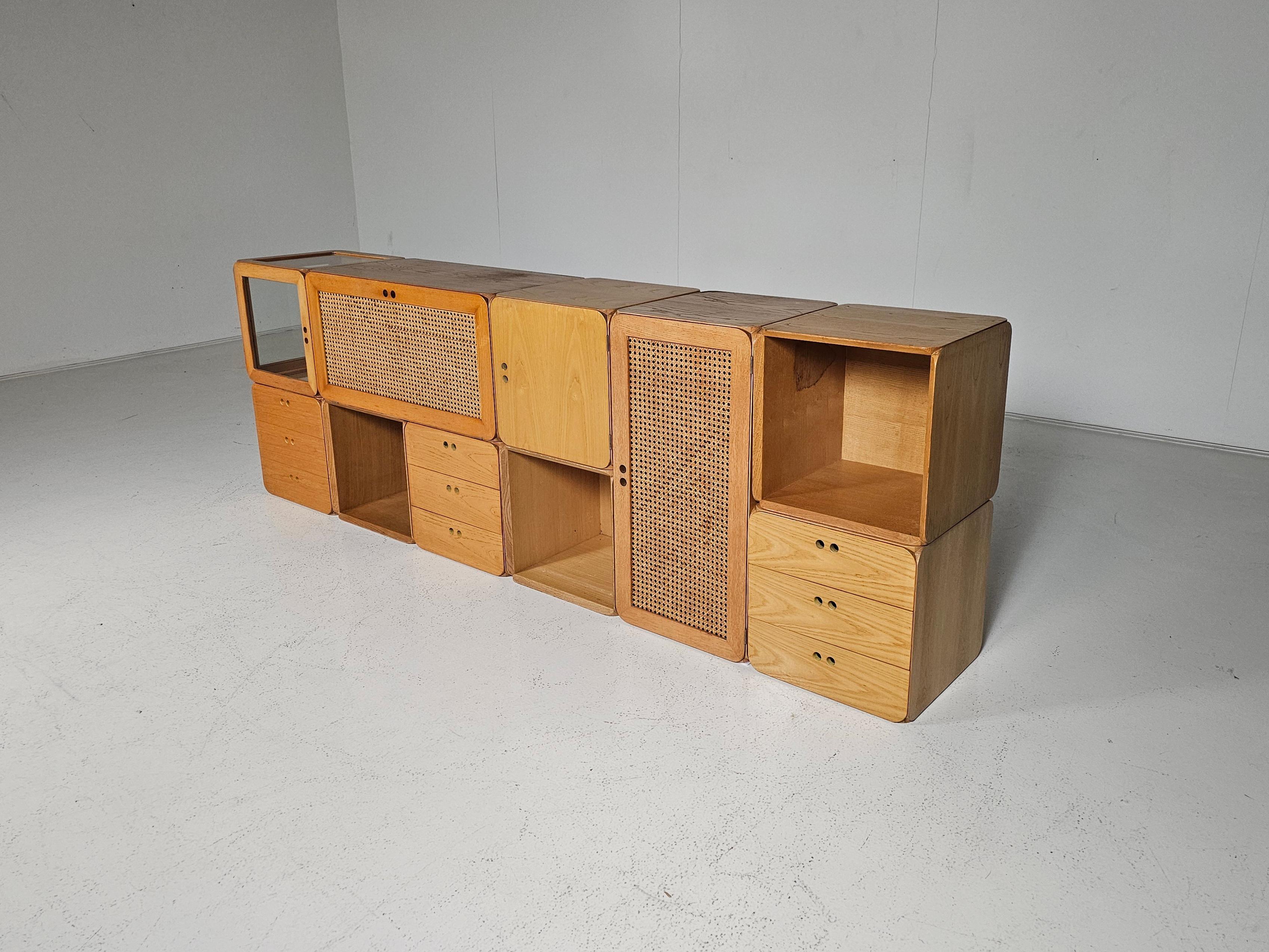 Modular wooden Samara storage wall unit by Dutch designer Derk Jan de Vries, created in the 1970s. This modular storing unit consists of ten volumes and includes shelves and drawers. It provides sufficient space to store and display items such as