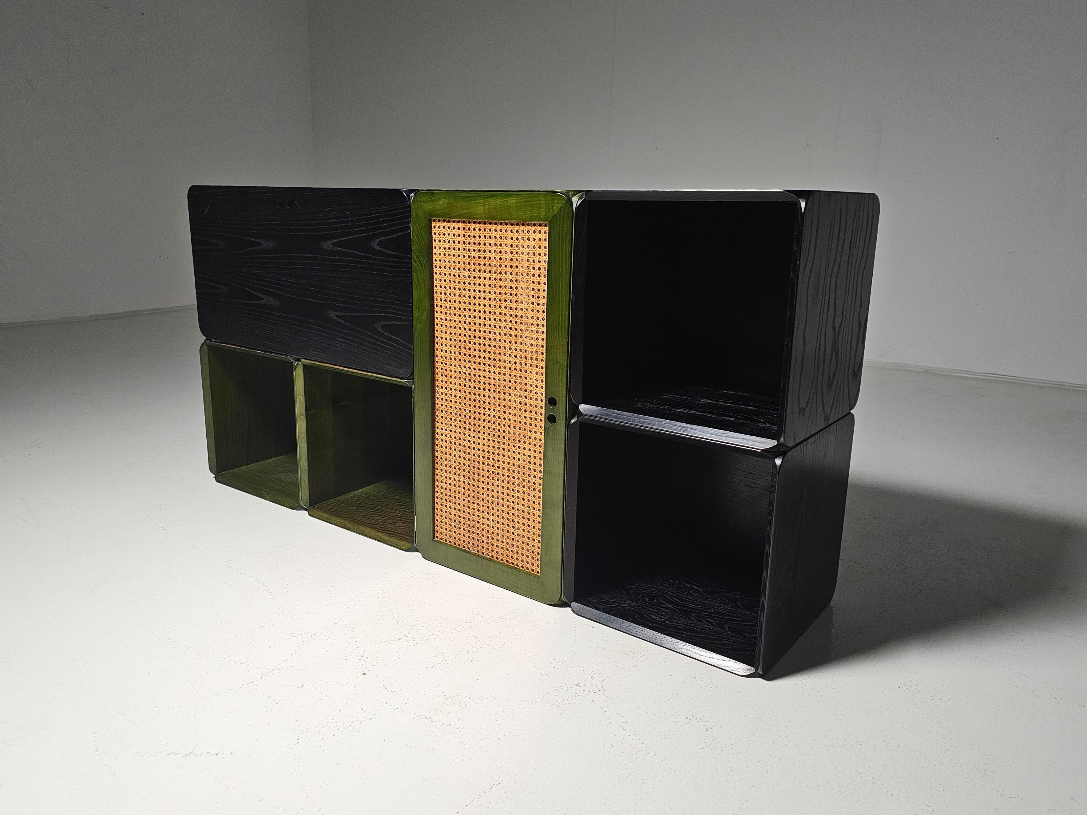 Modular wooden Samara storage wall unit in ash wood with a black and green finish. Designed by Dutch designer Derk Jan de Vries, created in the 1970s. 

This modular storing unit consists of six volumes and includes shelves and drawers. It provides