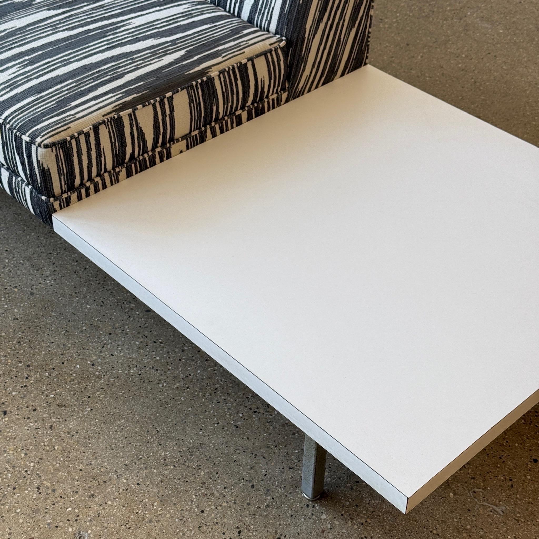 c. 1950s. USA. Reupholstered in Pierre Frey “Bourail” Jacquard fabric. Refoamed as well. White laminate side tables with metal frame. 

