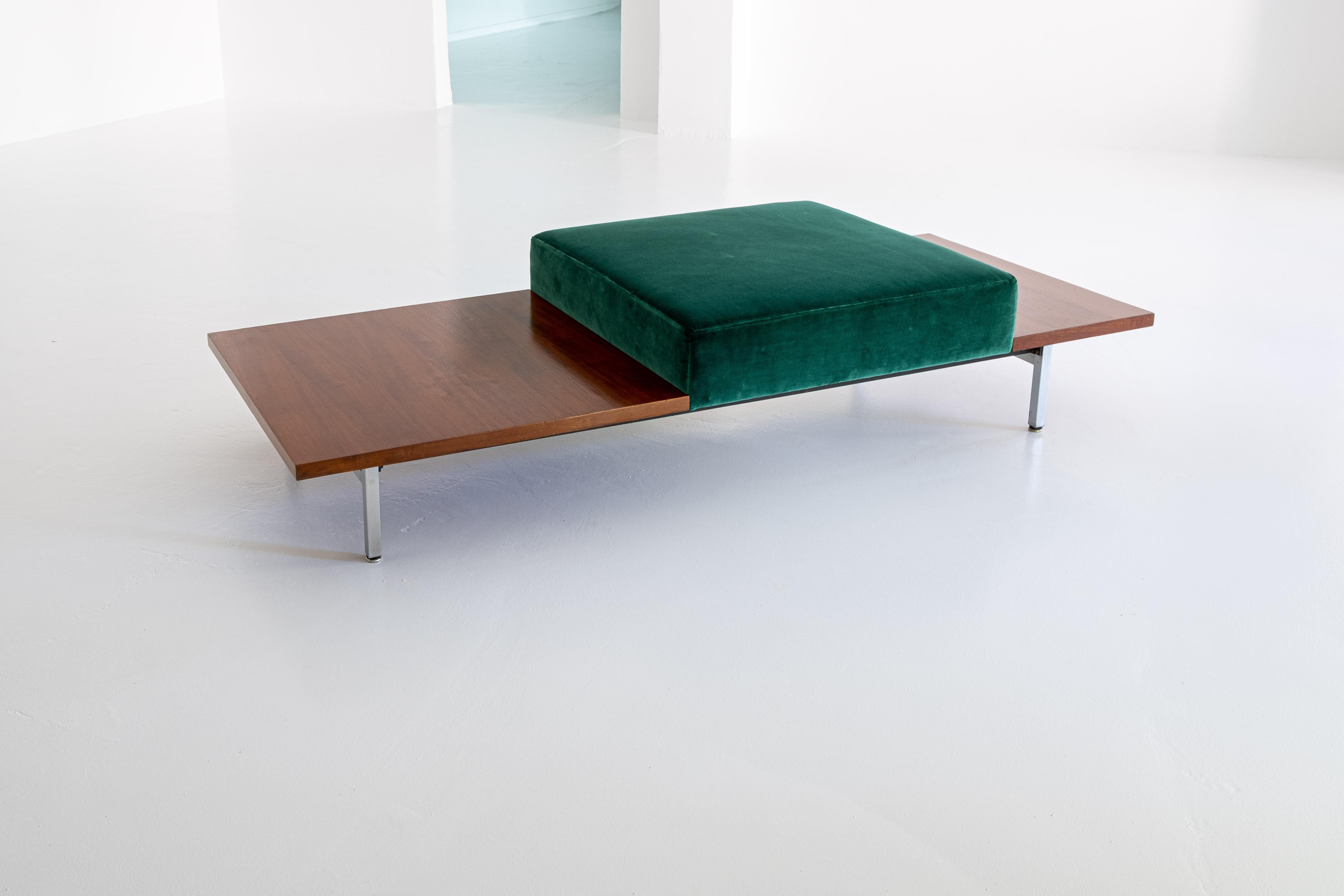 In 1955 George Nelson developed the „Modular Seating System“, including sofas, benches, sideboards and tables, interchangeable, based on steel frames. 

This table bench is a quite rare version consisting of a soft (newly) upholstered seating