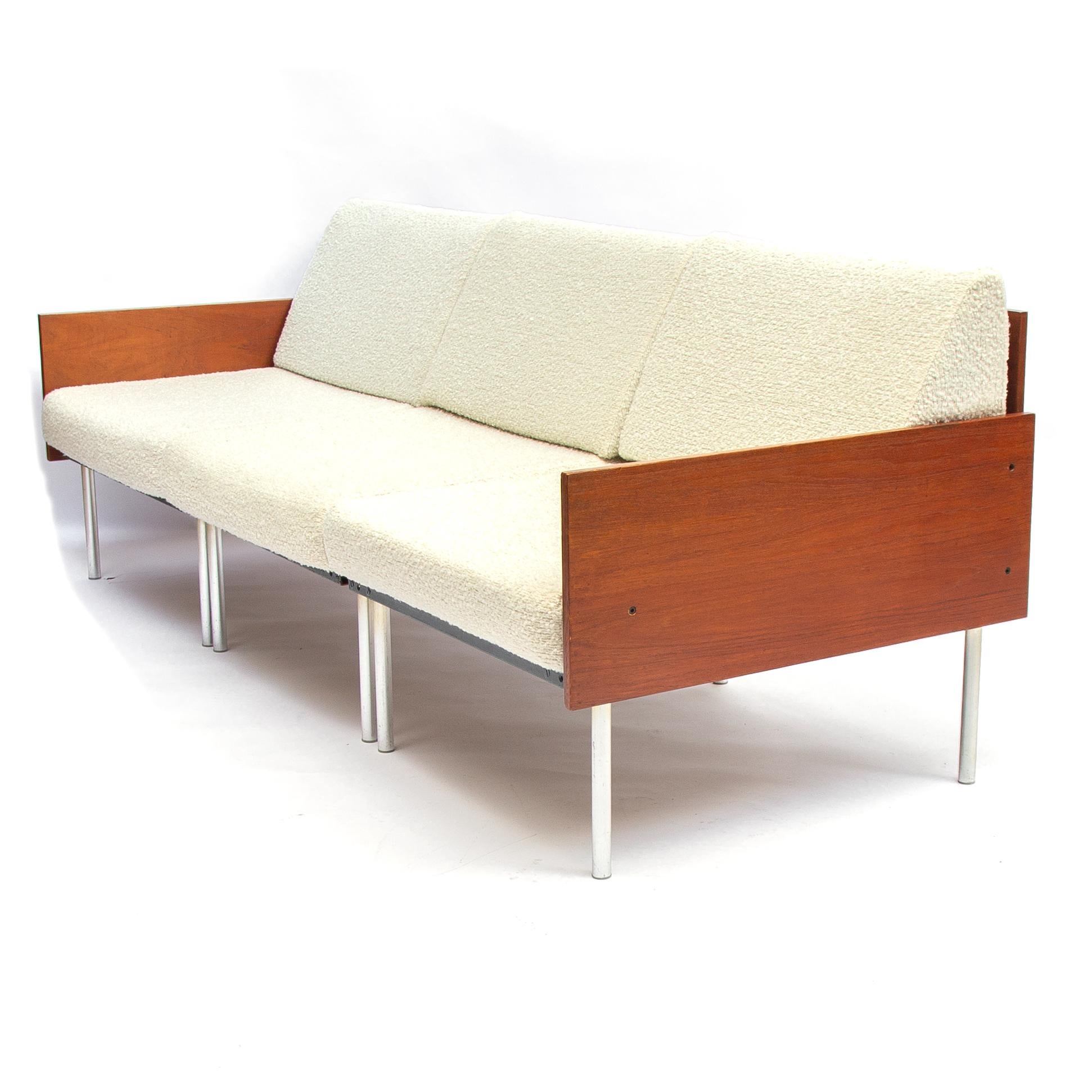 Early midcentury 100% Modular sectional sofa with teak wooden back, and armrests completely re-upholstered with a beautiful bouclé woolen Crackle fabric

Each separate section can be connected to either a mid section or a side section. the whole