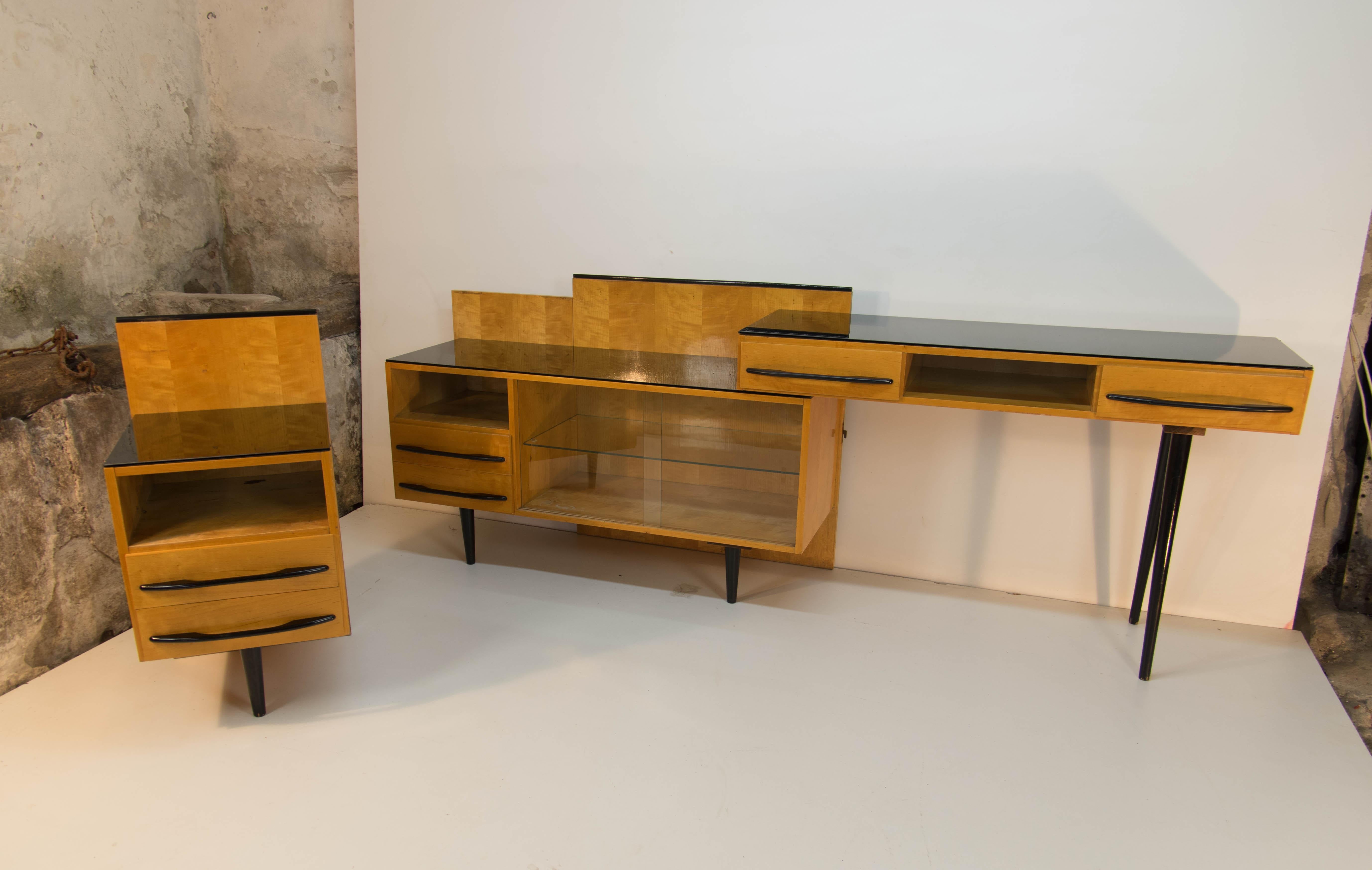 Modular set of three items designed by Arch. Mojmir Pozar for UP Zavody in 1960s. nightstand, chest of drawers and table could be assembled in different ways as you can see on photos. The writing or dressing table has 
disassembling legs and is