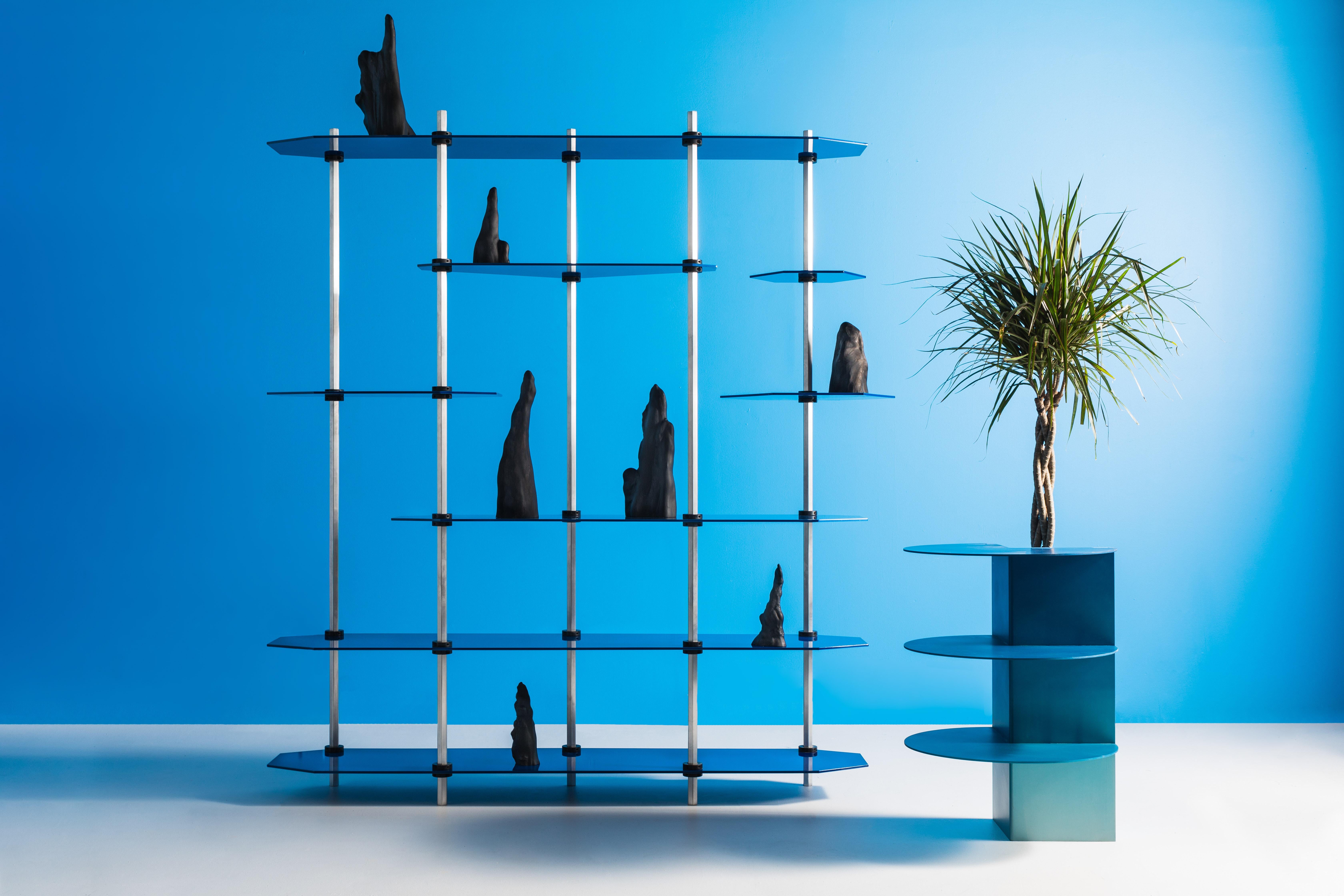 Designed entirely around standard factory-made “shaft collars” which clamp onto the posts to secure the shelves, the Hex Shelving system is easily assembled with nothing more than an allen key. A wide variety of shelf shapes and support sizes are