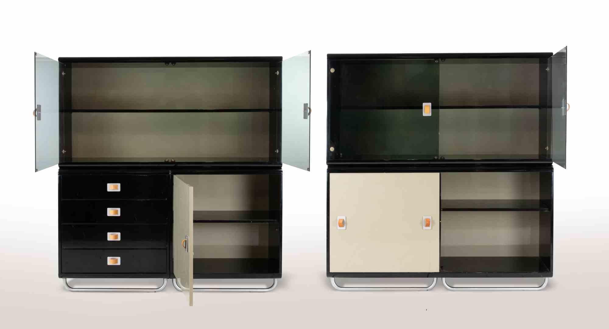 Modular sideboard  by Guido Faleschini for I4Mariani in 1970s.

Black and beige lacquered wood with chrome details and leather.

4 modules with chromed legs that act as a base, two double display cases and 4 single modules.

Some minor sign of wear
