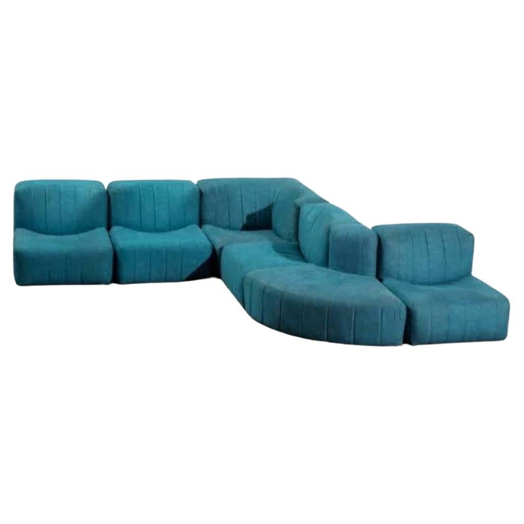 Tito Agnoli for Arflex Sectional Sofa Model '9000' in blue Upholstery
Modular sofa, designed by Tito Agnoli 1969, for Artflex. A compact, rounded seating system that allows the creation of many configurations. Created in the late 60s. 
The set