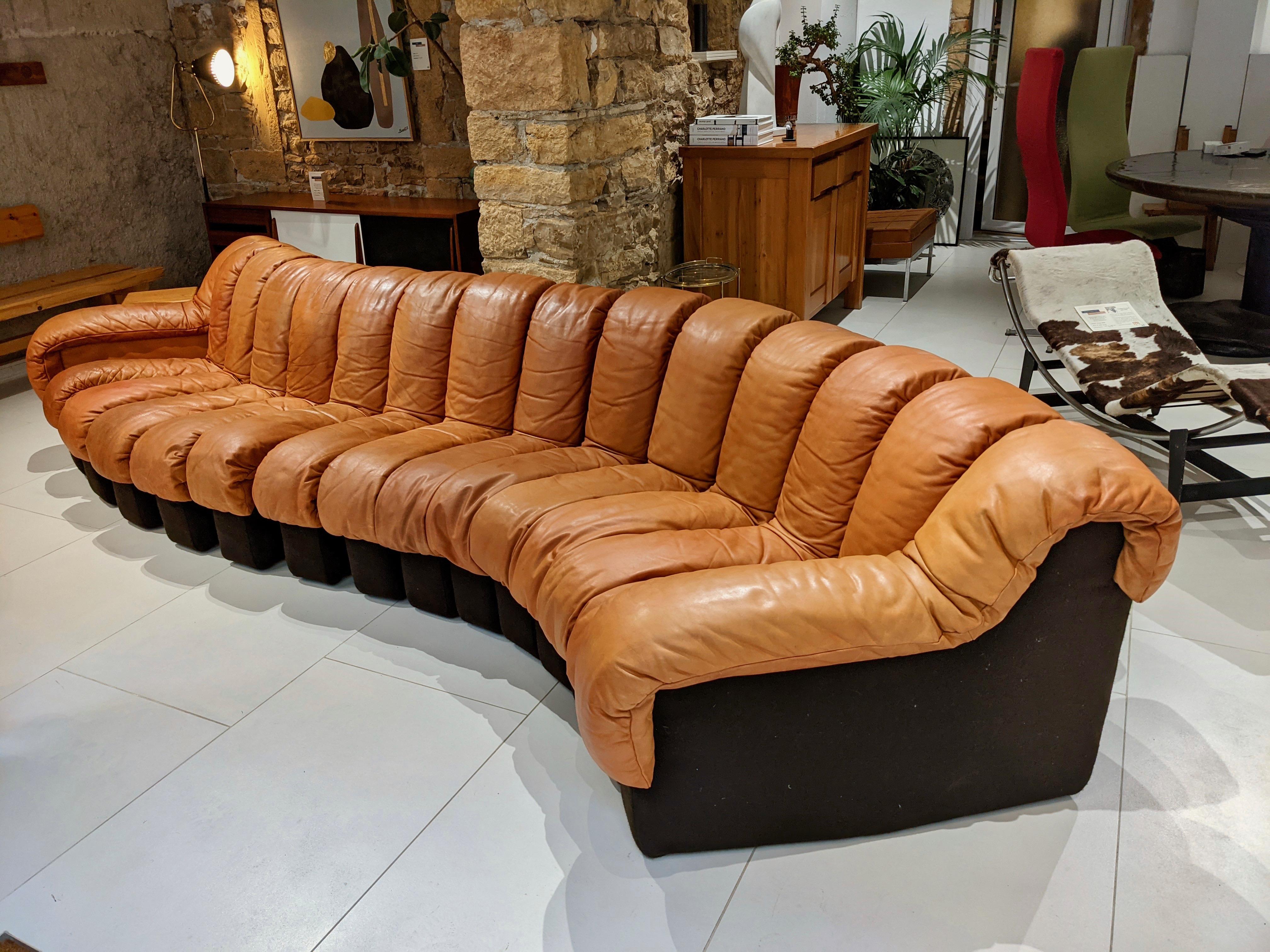 Modular sofa DS-600 by Berger, Peduzzi, Vogt & Ulrich for de Sede. Circa 1970. Camel coloured leather. Good condition. The sofa has some wear and tear visible in the picture. Some restorations have been done on one of the armrests and on the bottom