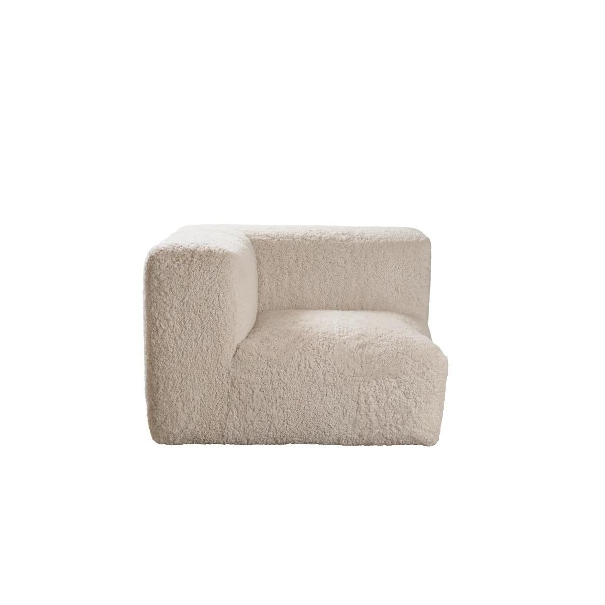 This modular sofa combines Scandinavian simplicity with luxurious comfort. Upholstered in premium Curly Short Wool sheepskin from New Zealand, each piece offers exceptional softness, natural warmth, and breathable, temperature-regulating