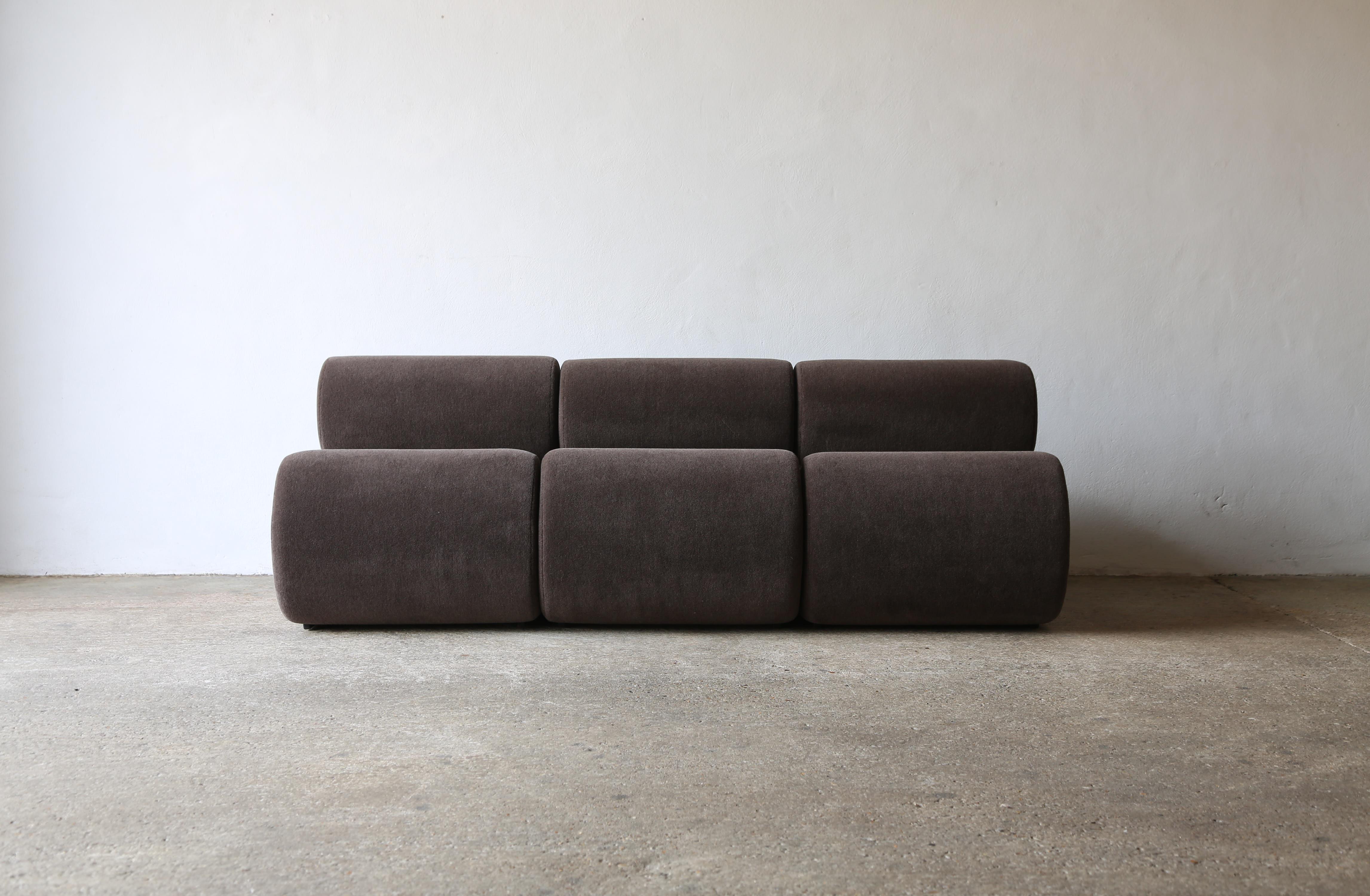 Modular sofa of three seating pieces, upholstered in a premium pure Alpaca wool fabric.   The bolster cushions are loose on the top of the bases.