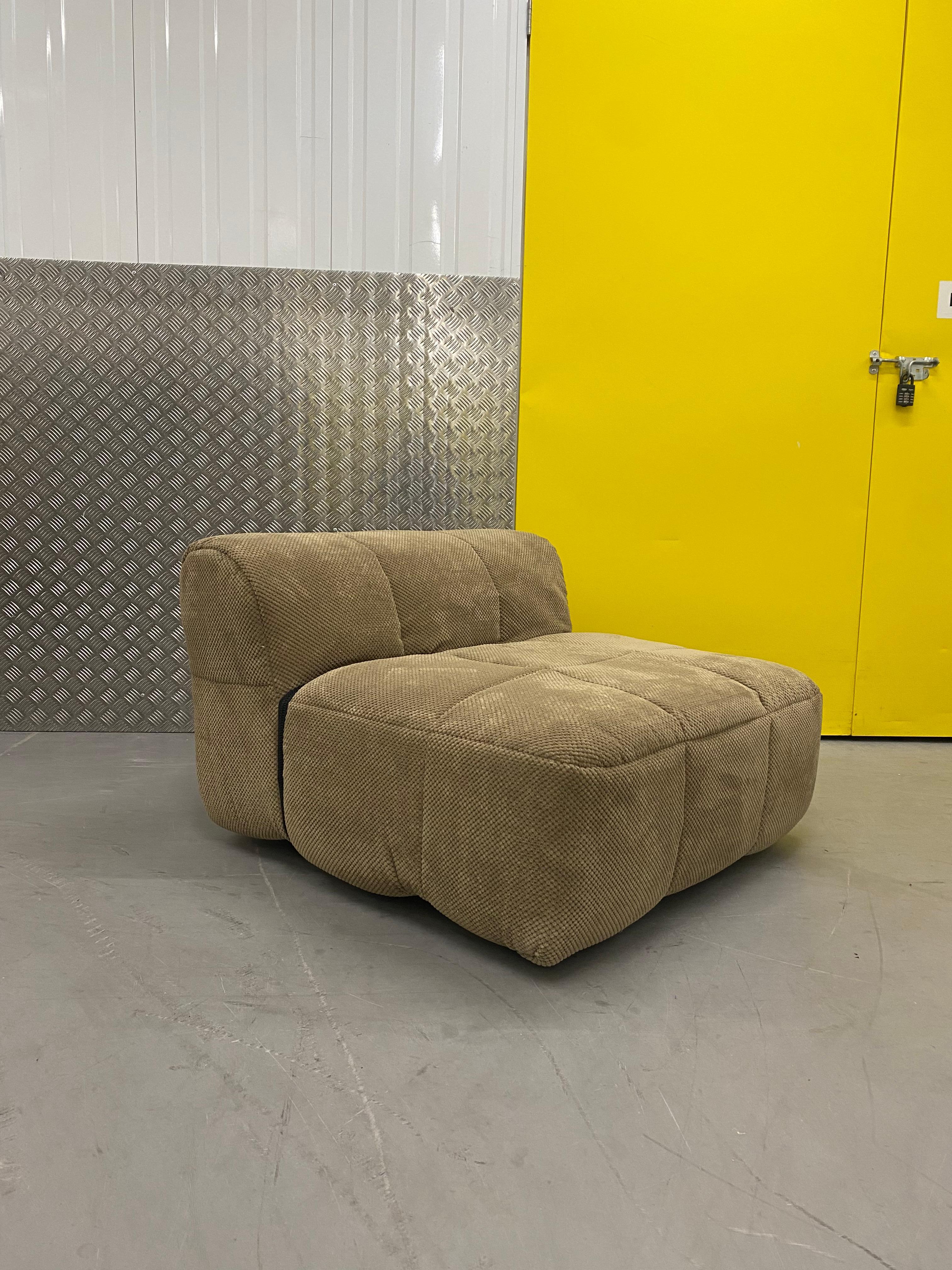 Modular Strips sofa by Cini Boeri for Arflex. 

The architect revolutionised the furniture market with this seating system, earning a compasso d’Oro in 1979. The sofa is characterised by a removable quilted lining, where the upholstery becomes an