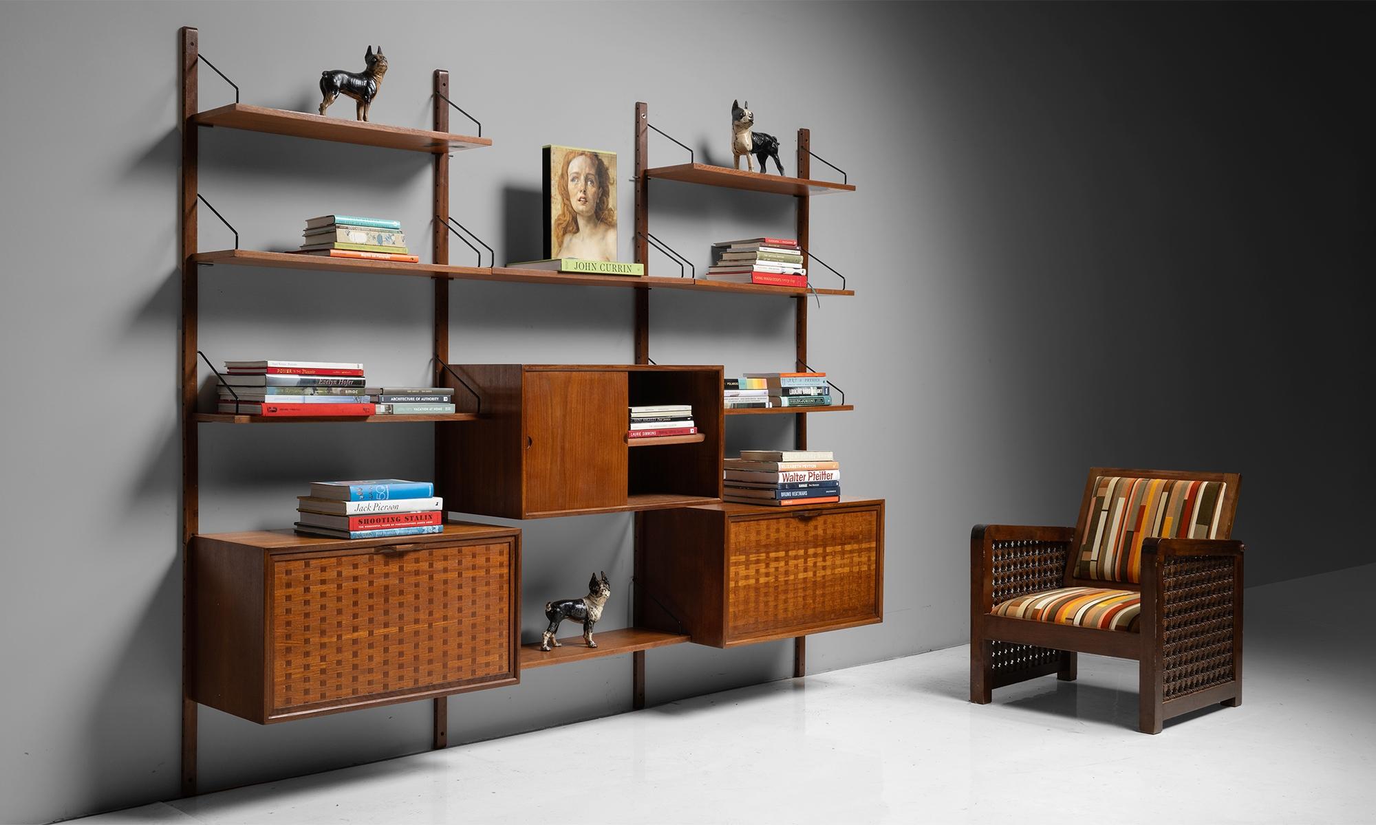 Modular Teak Wall Unit by Poul Cadovius

England circa 1950

Adjustable shelving and storage, constructed in teak with black metal brackets.

96”L x 15.25”d x 77.75”h