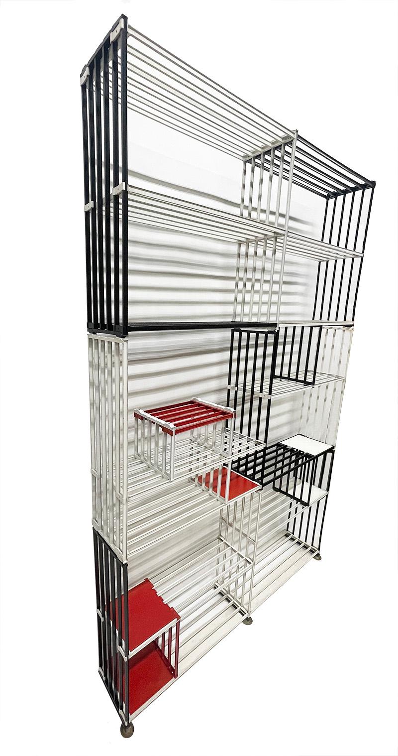 Modular wall bookcase by Tjerk Reijenga for Pilastro, ca 1960

A metal bookcase that can be arranged to taste with the division or width. The bookcase is assembled with uprights and shelves and attached with nuts and bolts. (some new) The uprights
