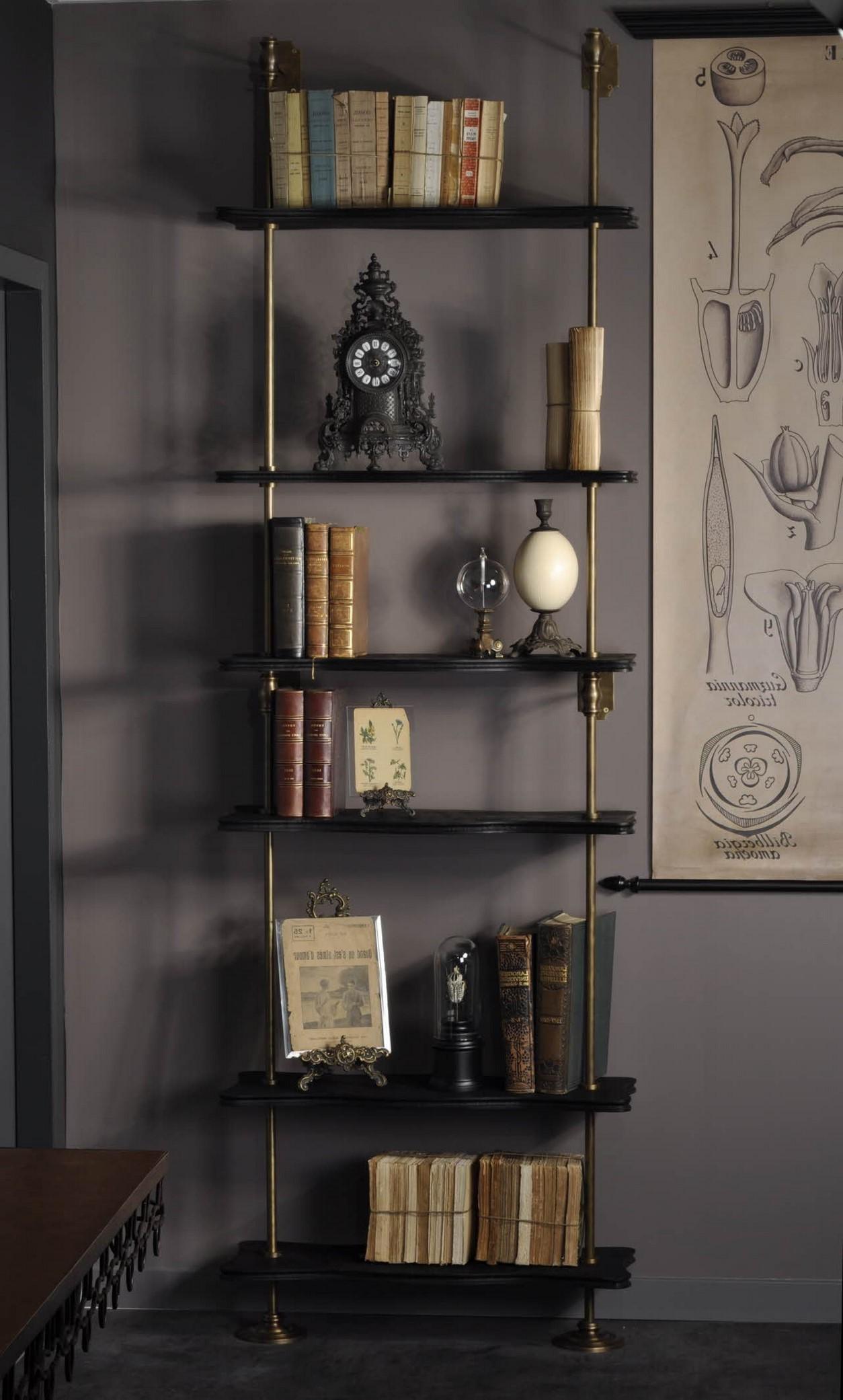 Modular wall unit system in brass and black lacquered wooden storage shelves composed of 6 black lacquered wooden shelves, a wall-mounted and patina brass structure. Practical, modular and design!