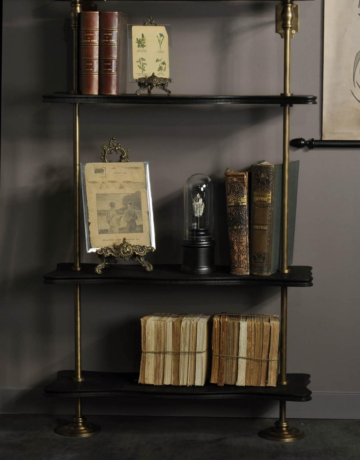 Modular wall unit system in brass and black lacquered wooden storage shelves composed of 3 black lacquered wooden shelves, a wall-mounted and patina brass structure. Practical, modular and design!