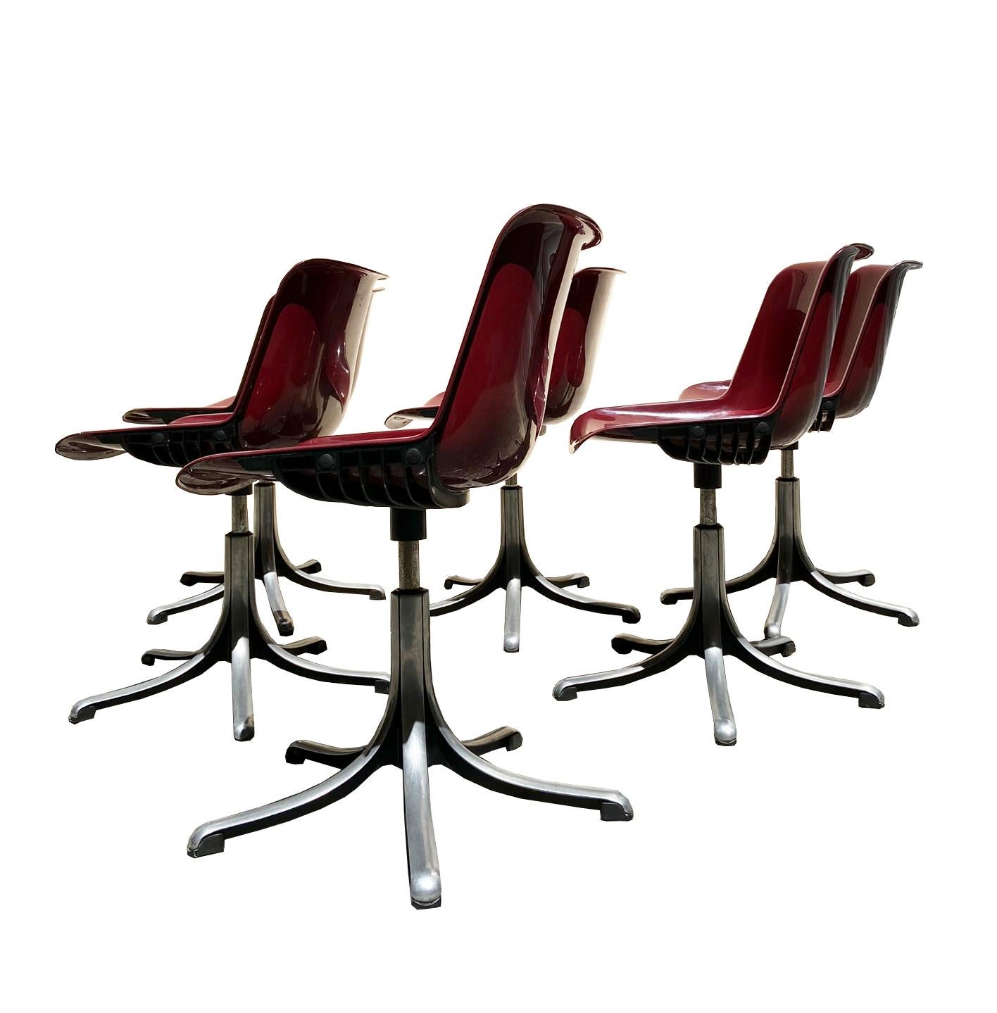 Set of six Modus chairs from the 1970s by the Italian designer Osvaldo Borsani for Tecno in dark red color equipped with an aluminum casting base and a plastic shell.