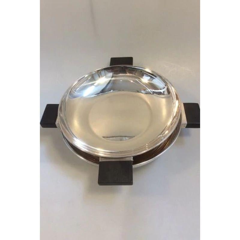 Mogens Bjørn-Andersen sterling silver lidded bowl with Ebony handles

Measures 29cm diameter and 10cm high ( 11.4