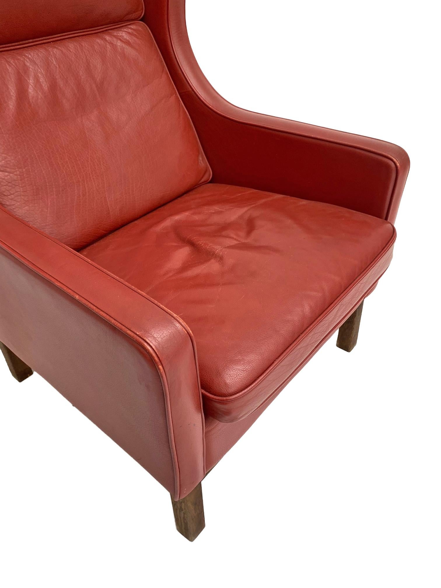 A classic yet striking design, this red leather 3 highback armchair by Mogens Hansen would make a wonderful addition to any home or work environment. 

In a charming Postbox red colour, this armchair would make a prominent feature for any space.