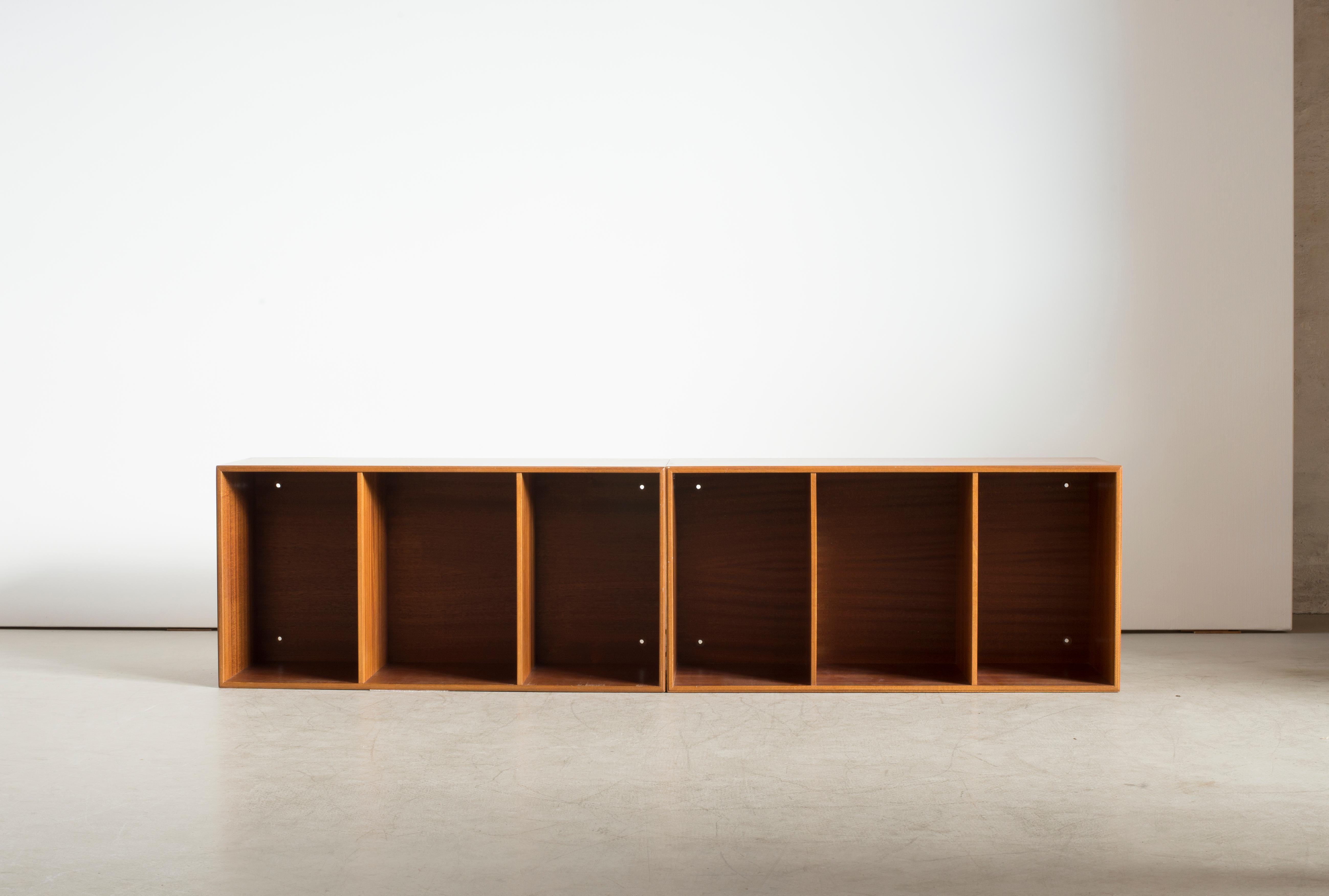 Mogens Koch two wall-mounted bookcases of mahogany. Executed by Rud Rasmussen.

Reverse with paper labels ‘RUD. RASMUSSENS/SNEDKERIER/KØBENHAVN/DENMARK.