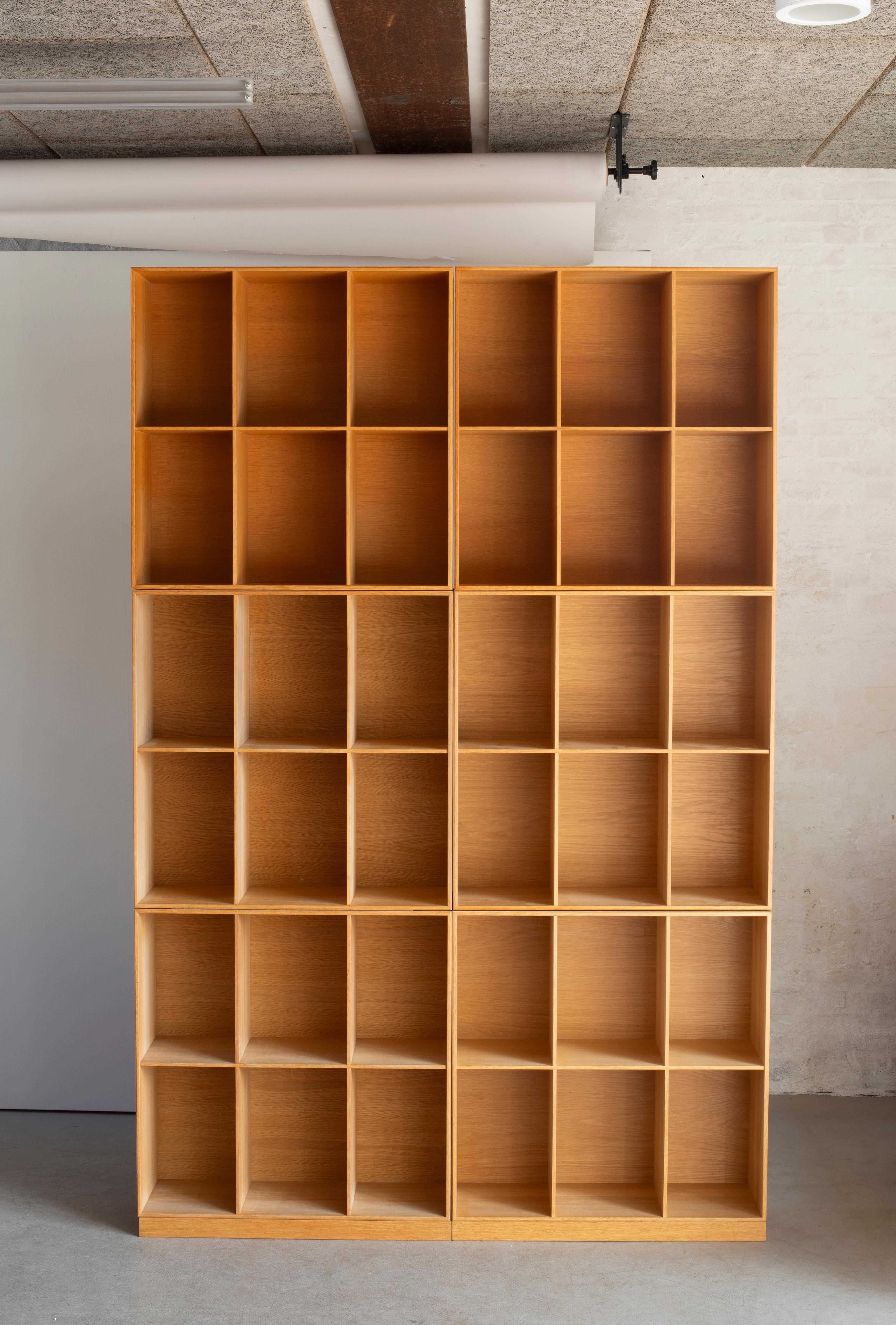 Mogens Koch bookcases in oak. Executed by Rud. Rasmussen.

Reverse with paper labels ‘RUD. RASMUSSENS/SNEDKERIER/KØBENHAVN/DENMARK.

Sold individually. 