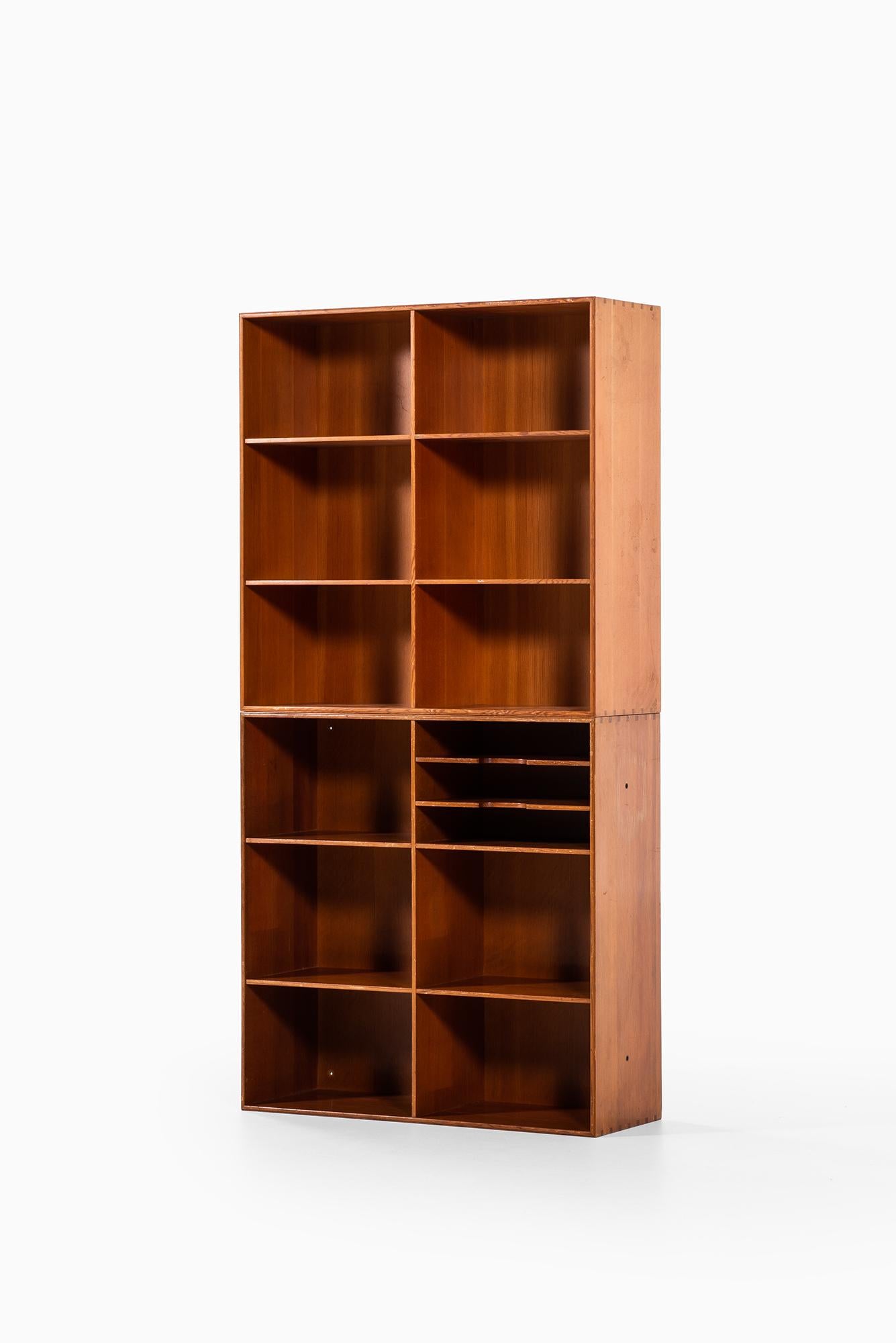 Pair of bookcases designed by Mogens Koch. Produced by Rud Rasmussen in Denmark.