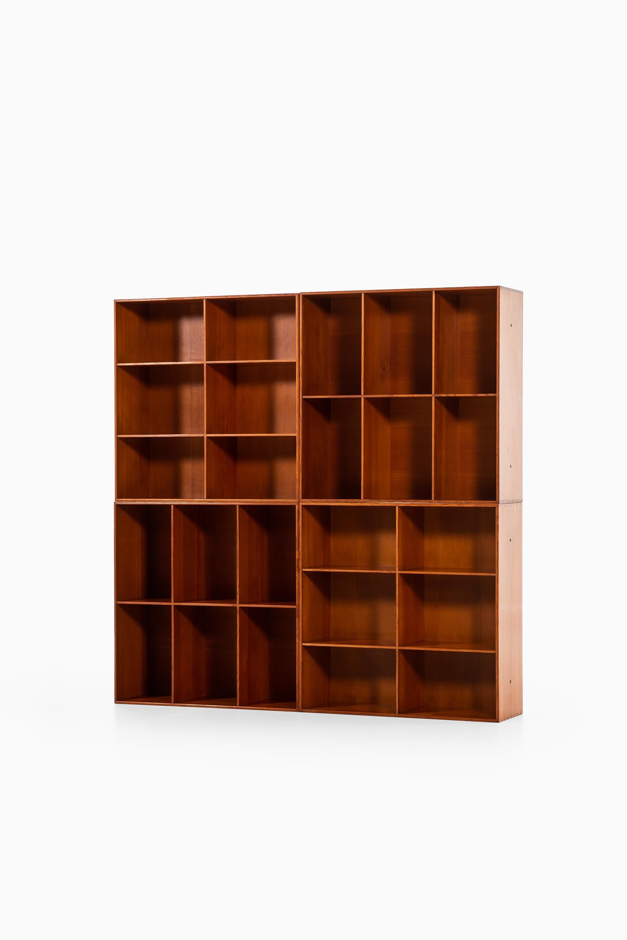 Set of 4 bookcases designed by Mogens Koch. Produced by Rud Rasmussen in Denmark.