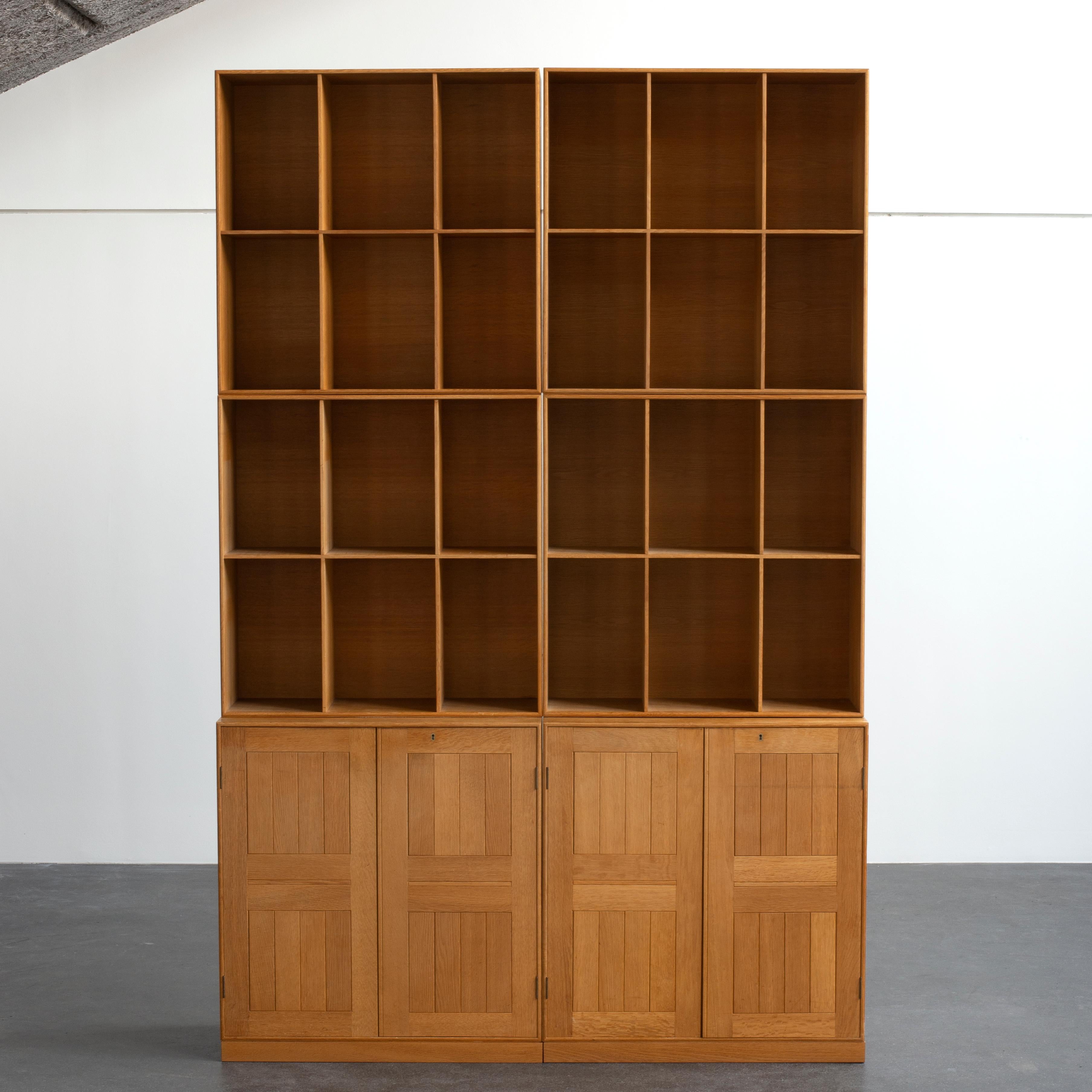 Mogens Koch cabinets and bookcases in oak Executed by Rud. Rasmussen.

Reverse with paper labels ‘RUD. RASMUSSENS/SNEDKERIER/45 NØRREBROGADE/KØBENHAVN'.