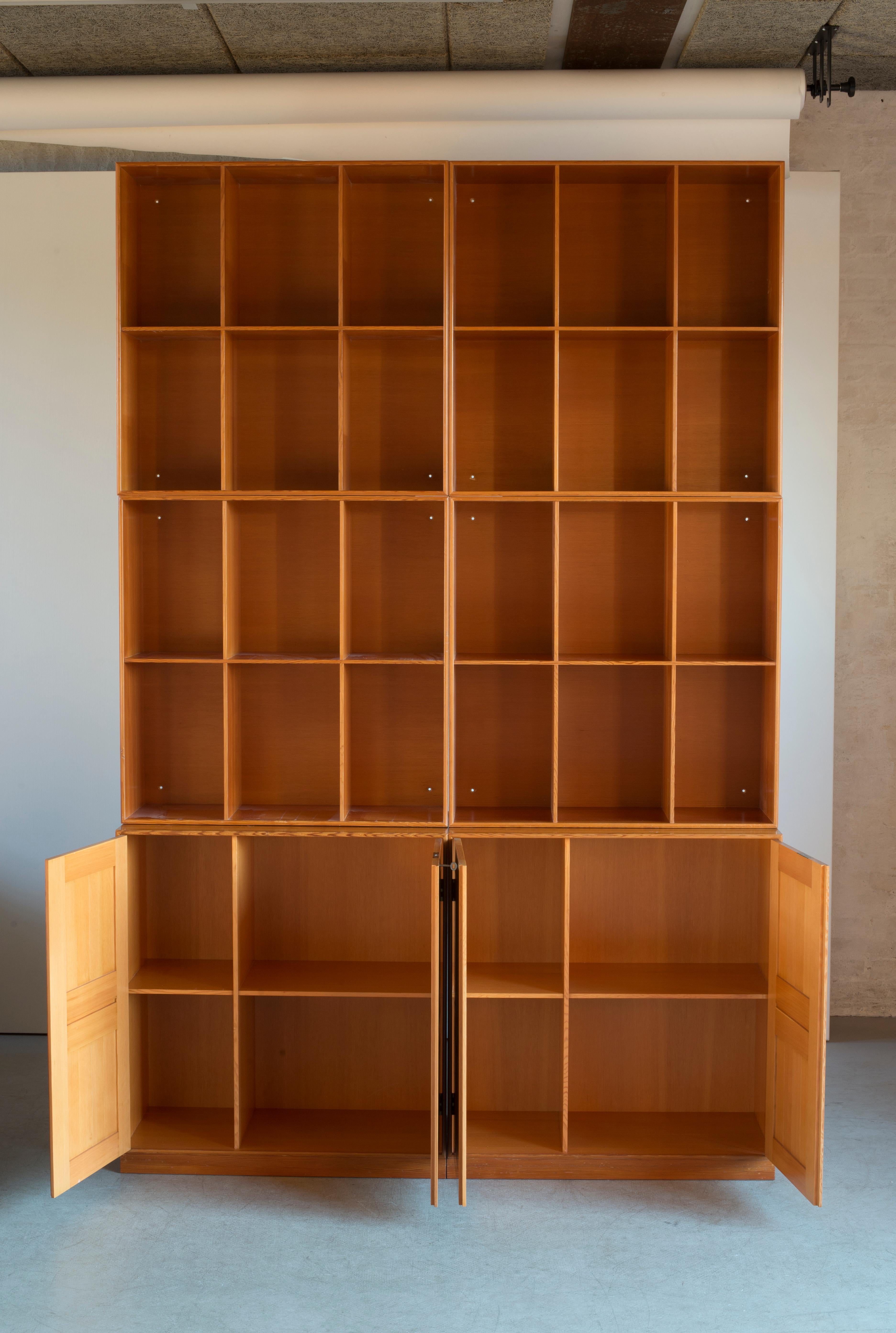 Mogens Koch cabinets and bookcases in Oregon pine. Executed by Rud. Rasmussen.

Reverse with paper labels ‘RUD. RASMUSSENS/SNEDKERIER//KØBENHAVN/DENMARK.